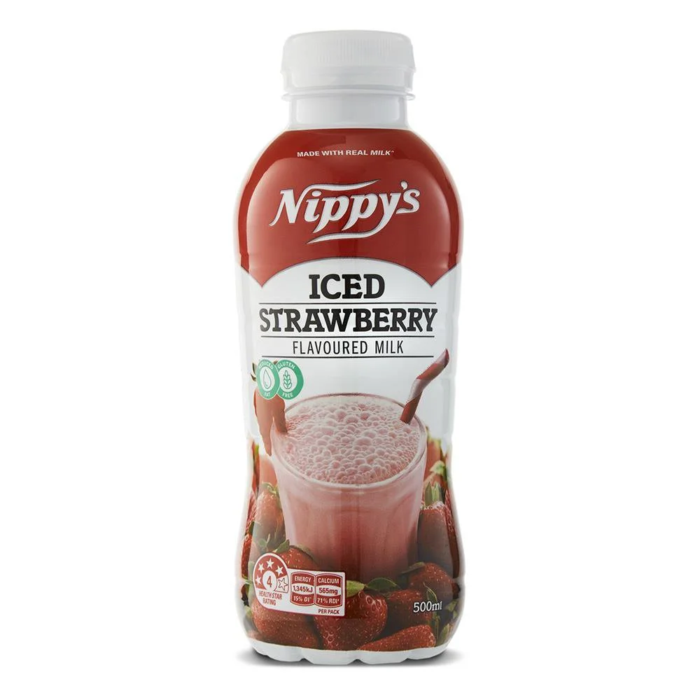 A 500ml bottle of Nippy's Iced Strawberry Flavored Milk, featuring strawberries and a glass of pink strawberry milk on the label.
