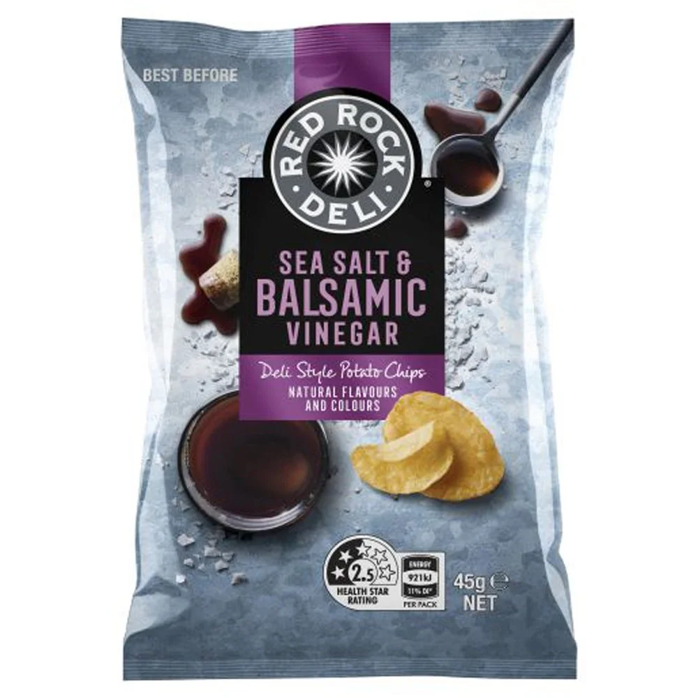Bag of Red Rock Deli Sea Salt and Balsamic Vinegar potato chips showing a bowl of balsamic vinegar, some potato chips, and ingredients like salt and balsamic vinegar.