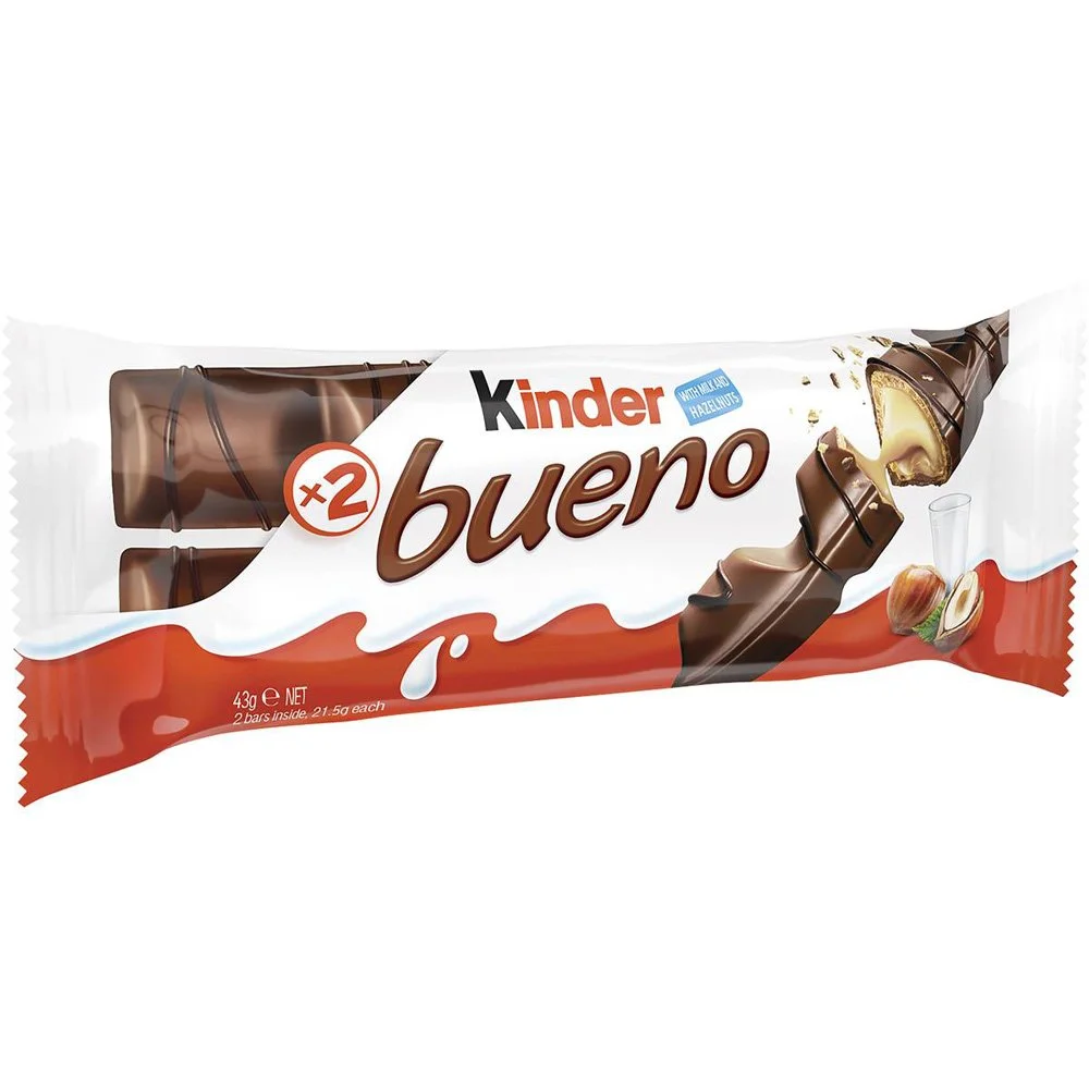 Kinder Bueno chocolate snack packaging with hazelnuts and milk glass
