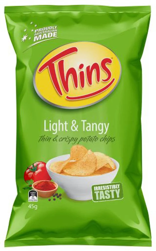 Green bag of Thins Light & Tangy potato chips with a bowl of chips, tomato, and seasoning on the front.