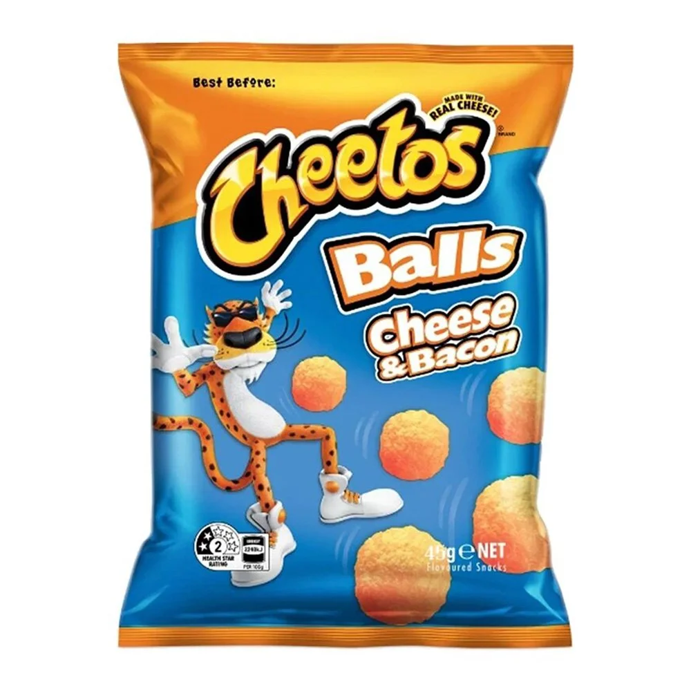 A bag of Cheetos Balls cheese and bacon flavored snacks. The bag features Chester Cheetah, the Cheetos mascot, wearing sunglasses and white sneakers, with some cheeseball snacks floating around him.