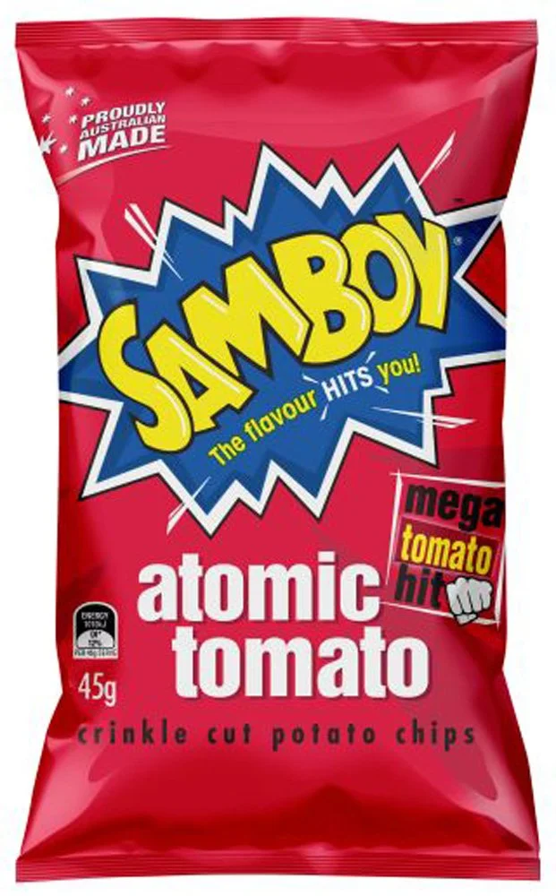 Red packet of Smaboy Atomic Tomato crinkle cut potato chips with bold yellow, blue, white, black, and red text, claiming 'The flavor hits you!' and 'Mega tomato hit'.