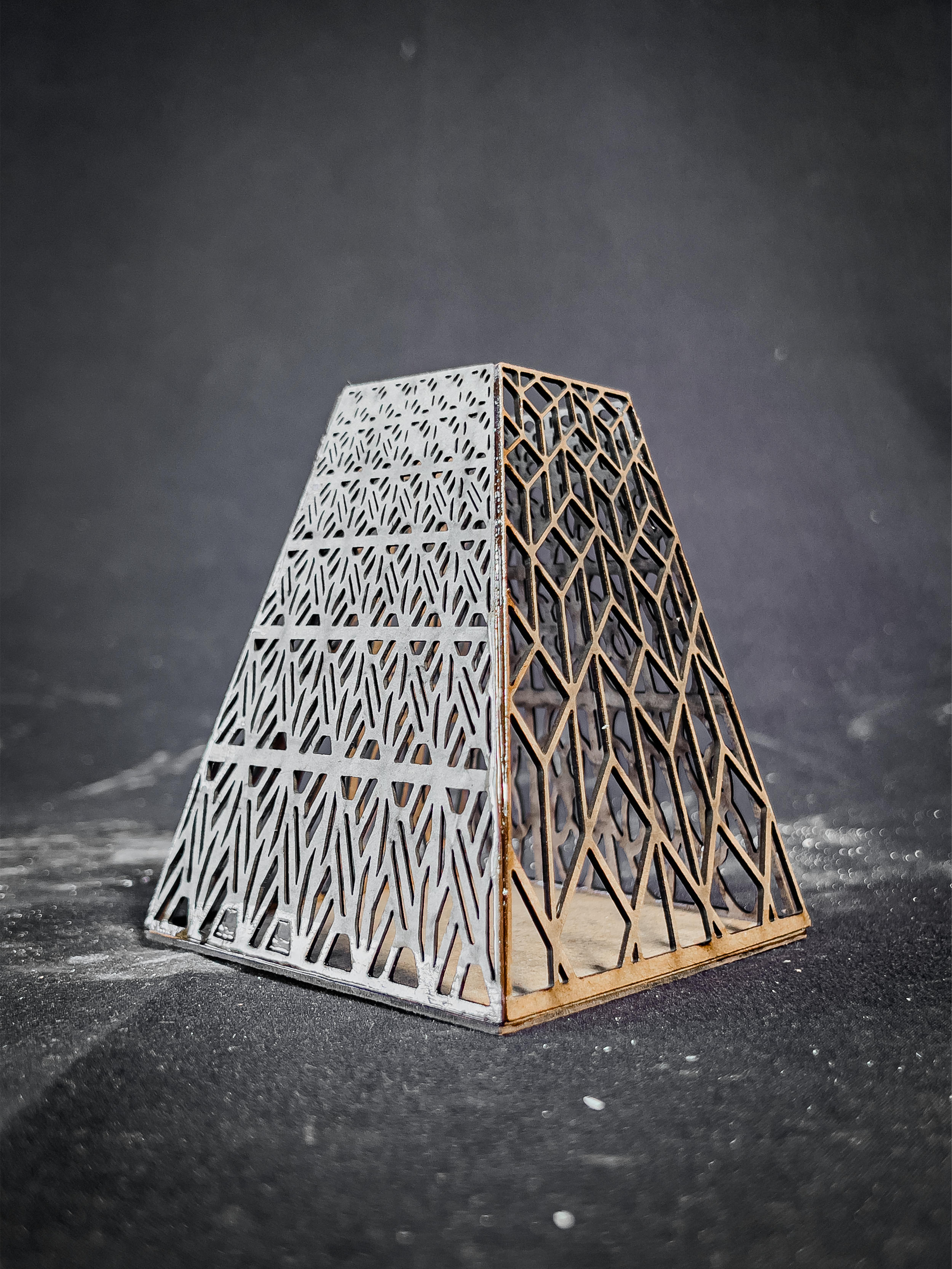 The process was inspired by the idea of placing a source of light in the center, and then projecting the perforated shapes through the shadows it casts.