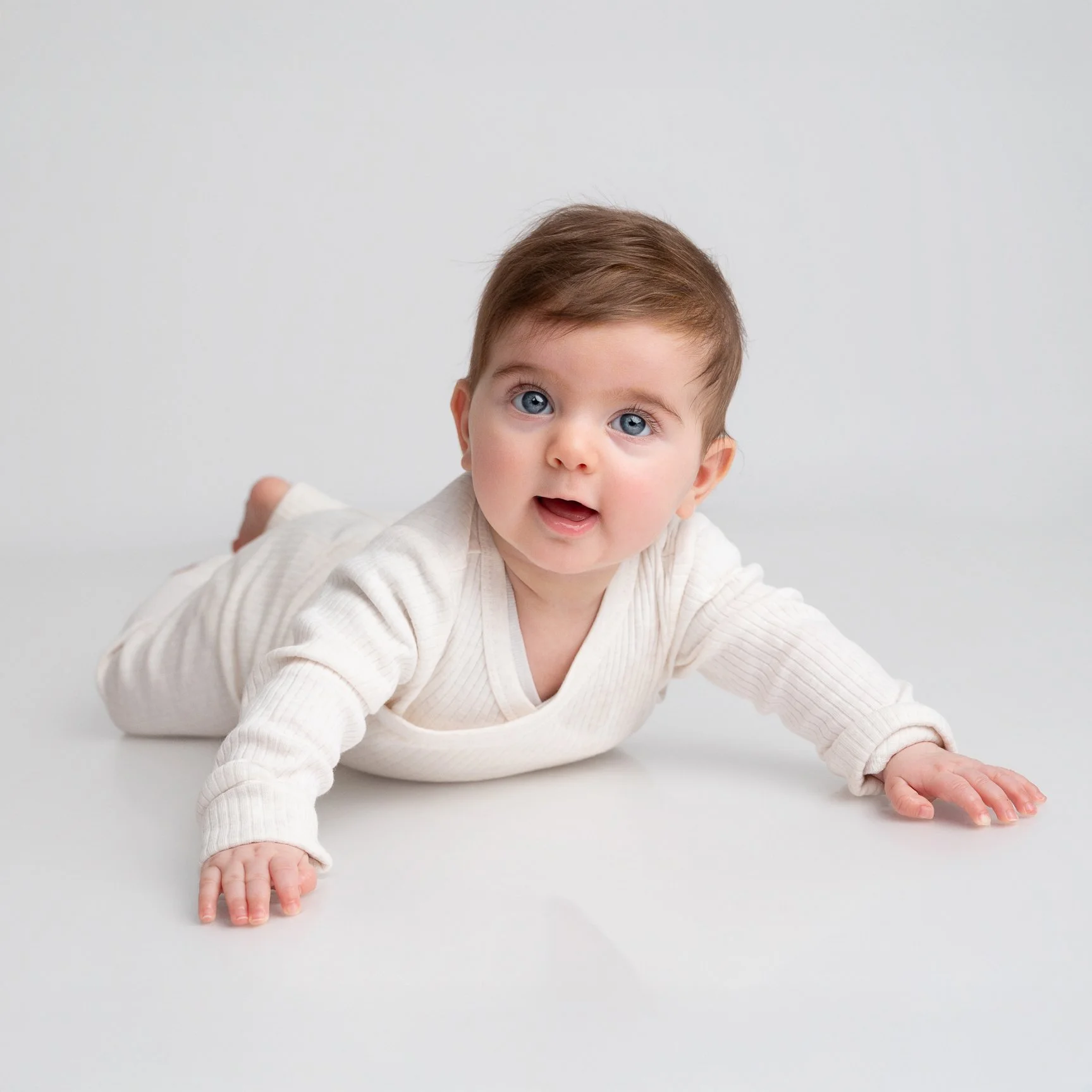 cute-baby-smiling-for-a-family-studio-photography-session