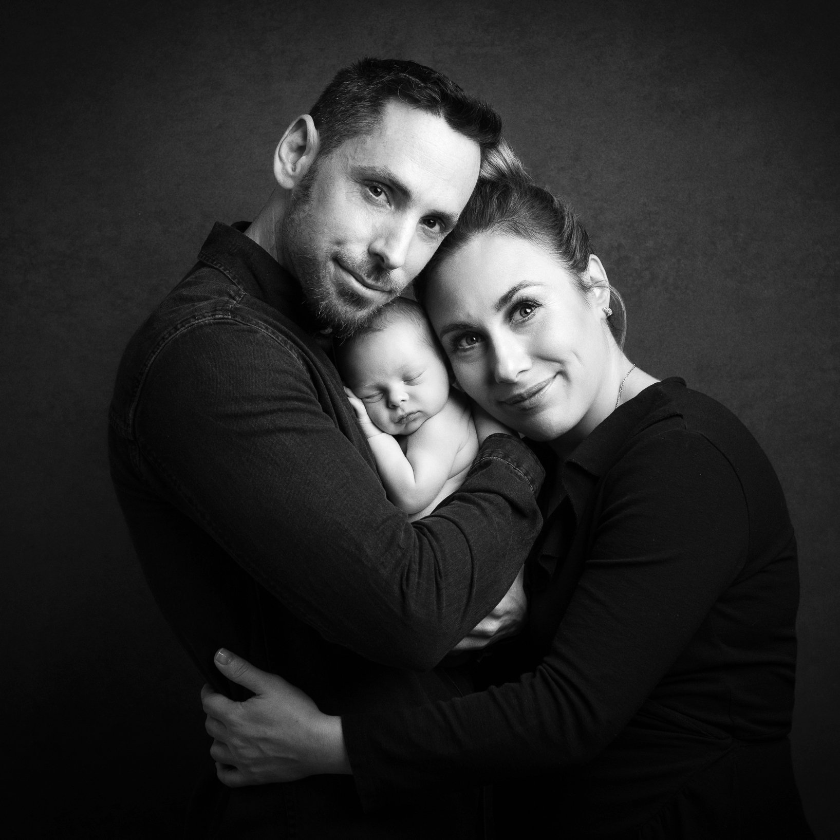 black-and-white-photo-proud-parents-with-their-newborn-baby