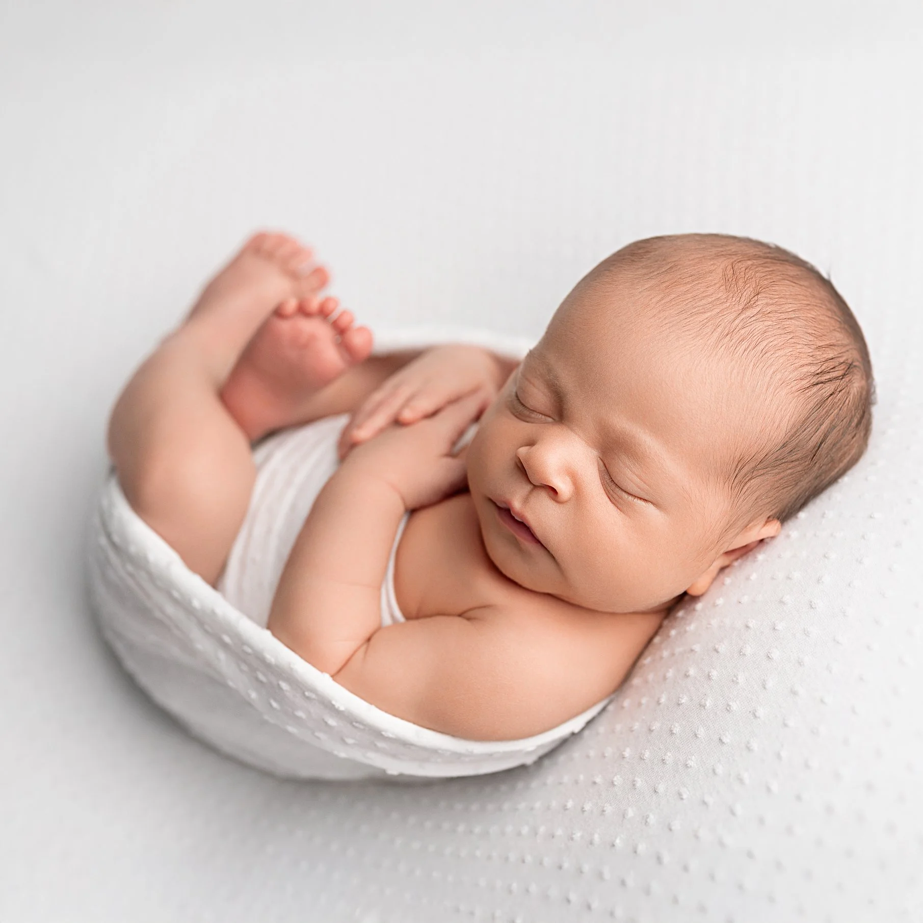 Newborn-baby-simple pose-on white-newborn-photoshoot-north-london