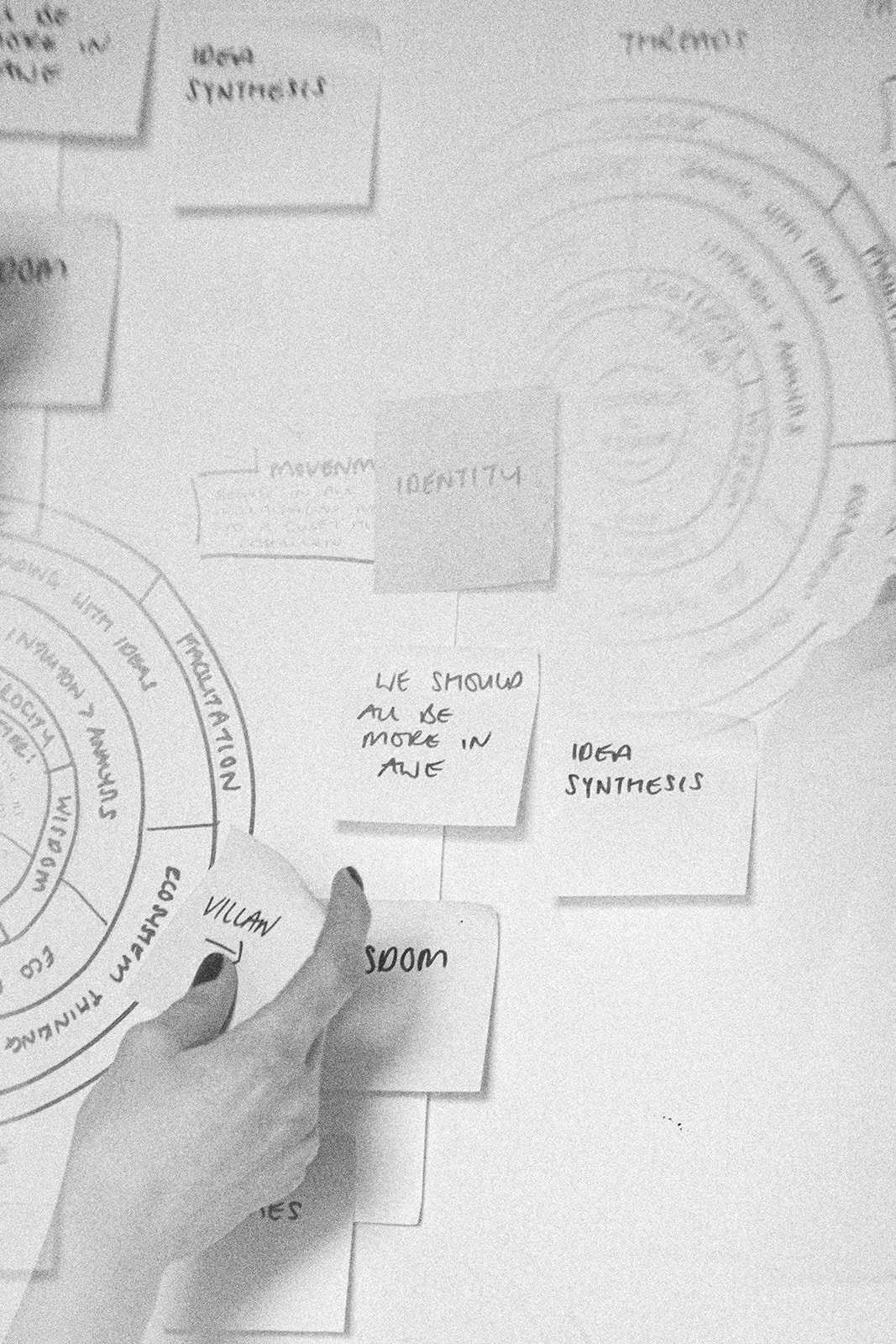 Black and white image of a girl in a swimming costume in the sea, with hands pointed to the sky. Positioning and Thought Leadership Strategist for multifaceted female founders.