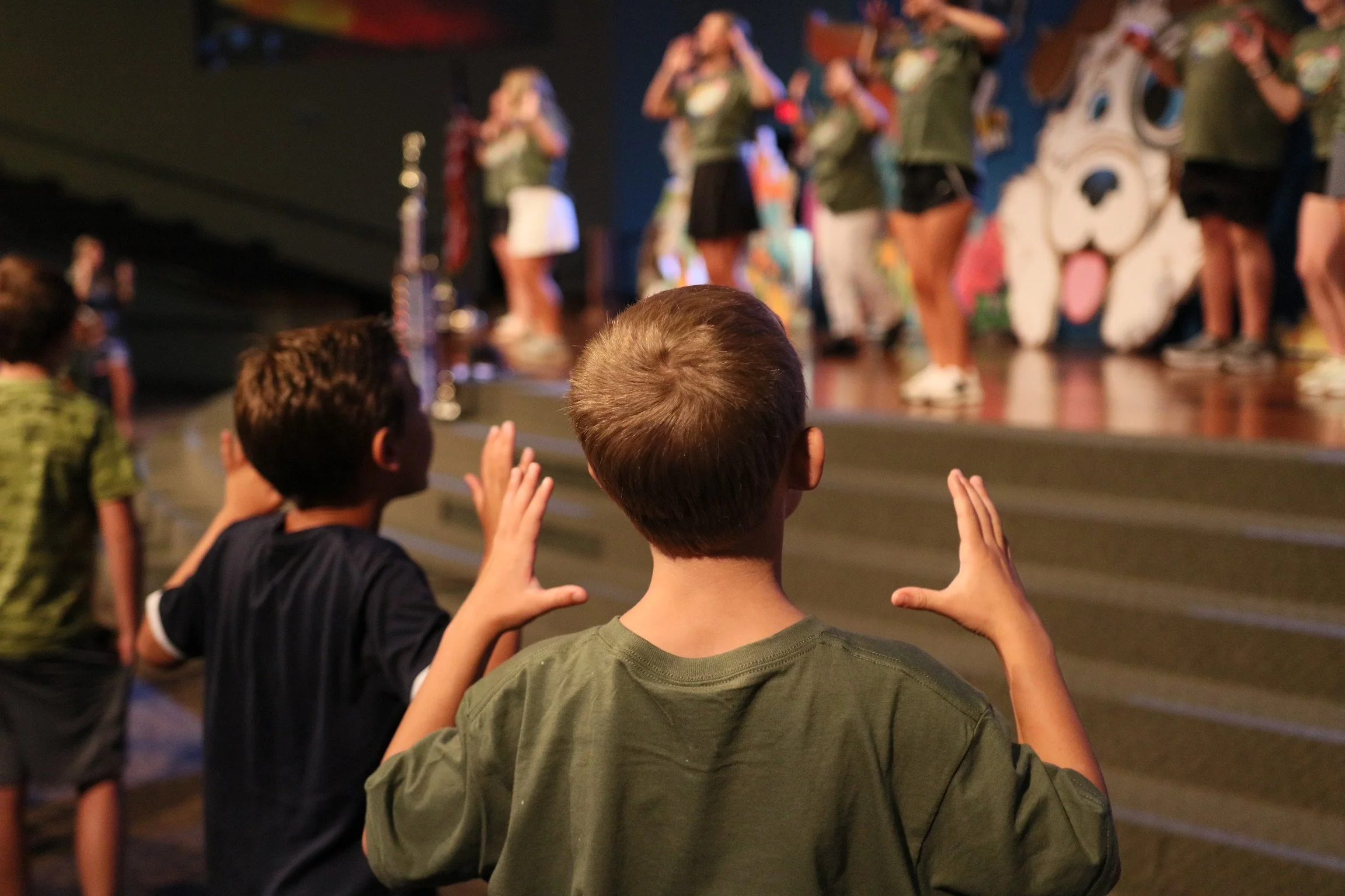 A boy dancing at VBS