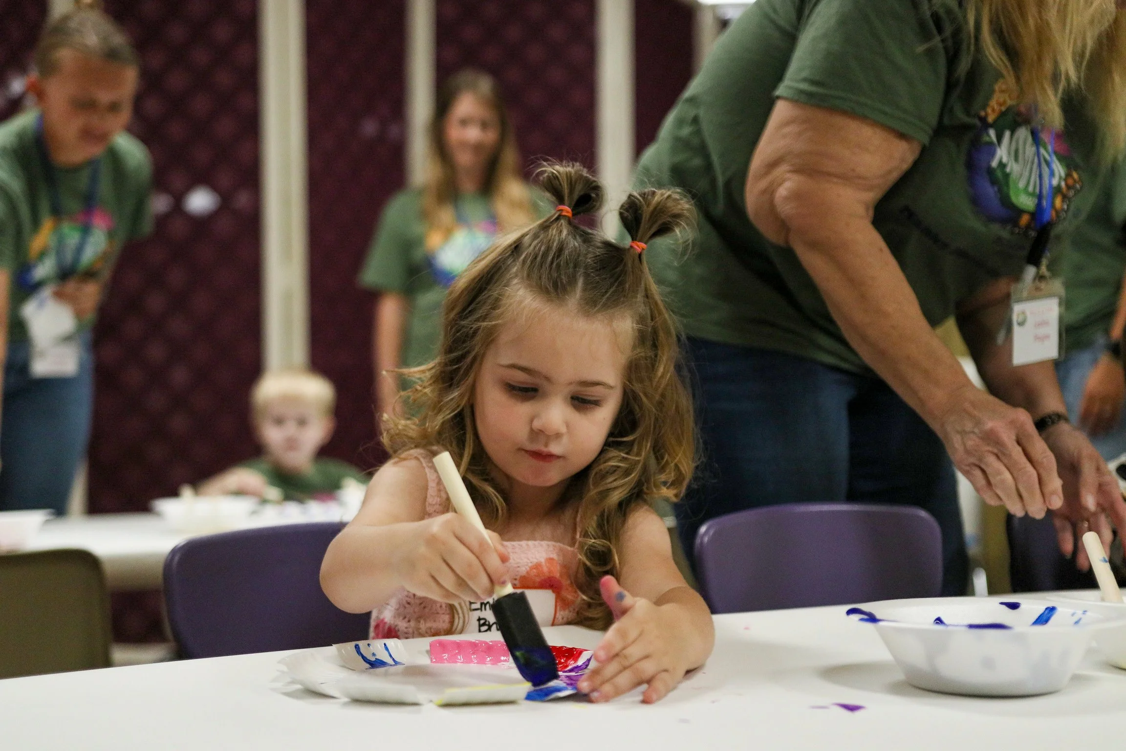 A Preschooler doing a craft at VBS