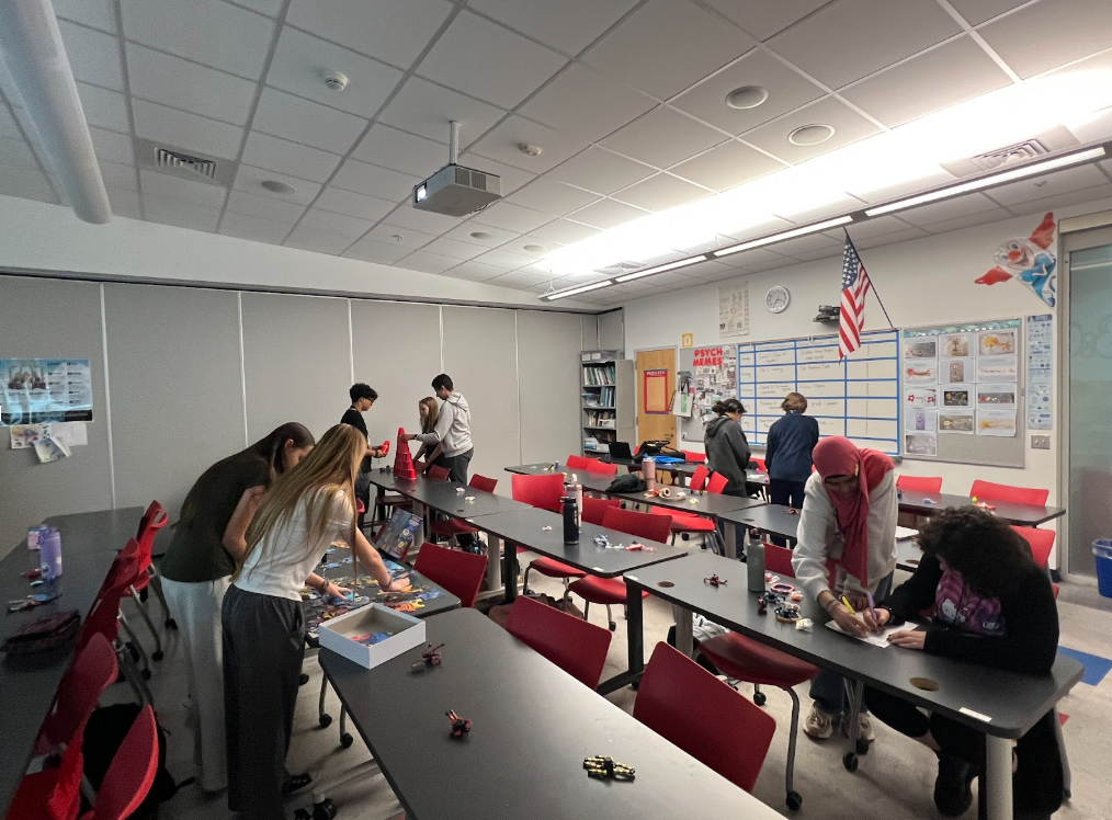 Photo of students working on activities at a club