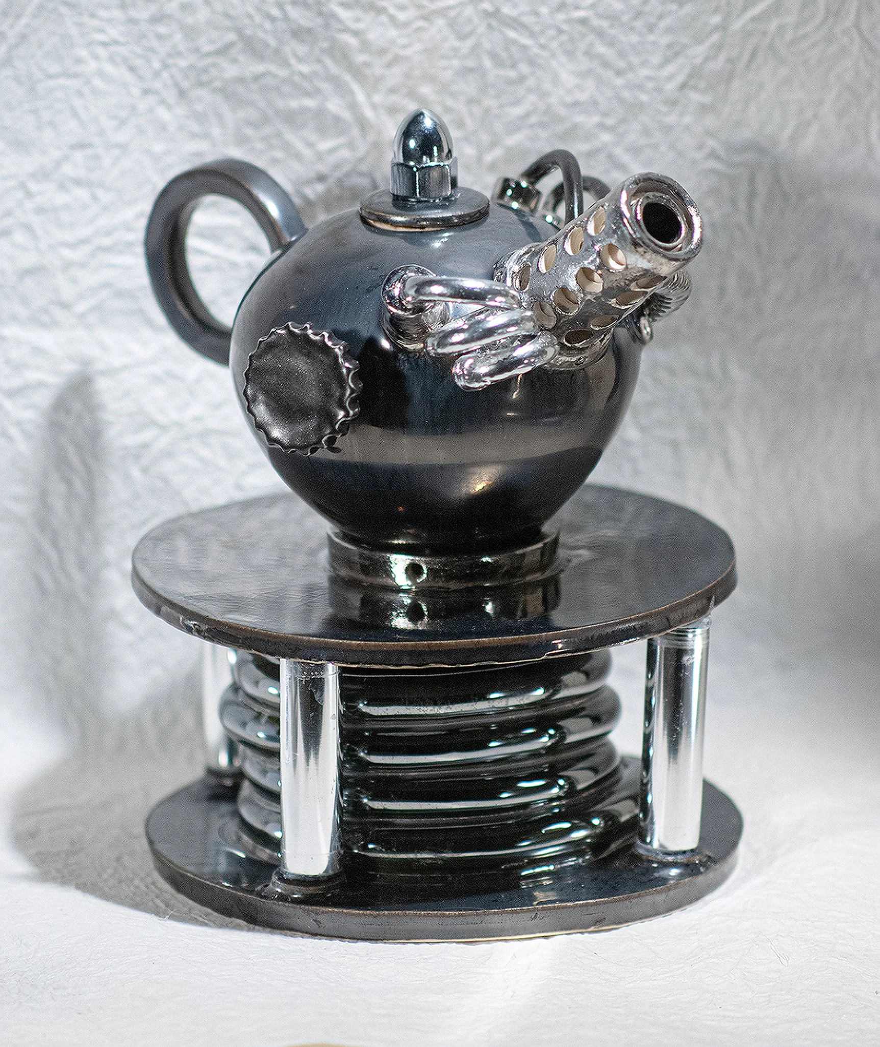 Robert Snyder -
Scottsdale, Arizona. 
“Spring”
Wheel-thrown and hand-built porcelain fired to cone 5, then luster fired with
silver luster.
9.75 x 10.25 in