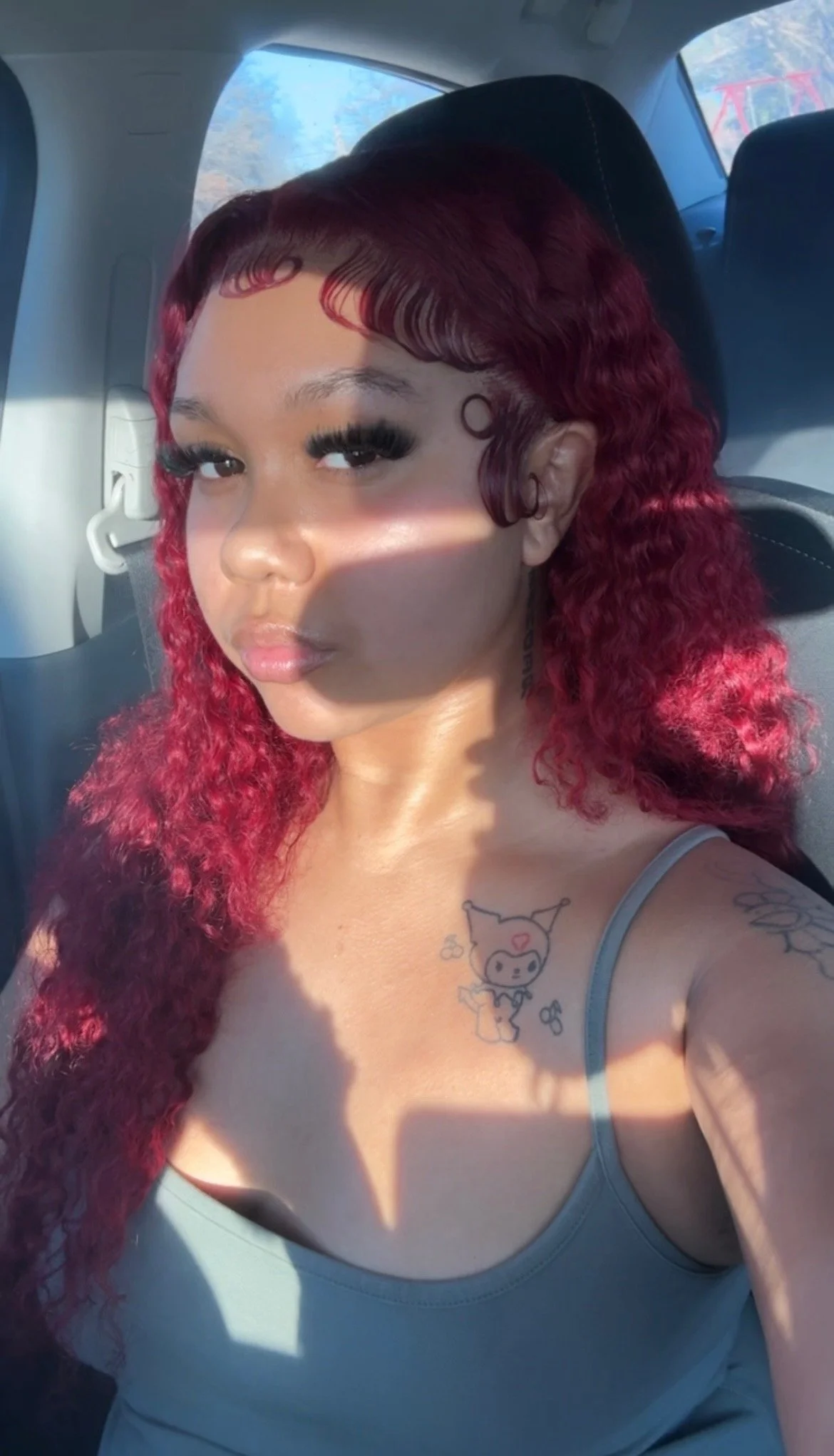 Aaliyah sitting in car