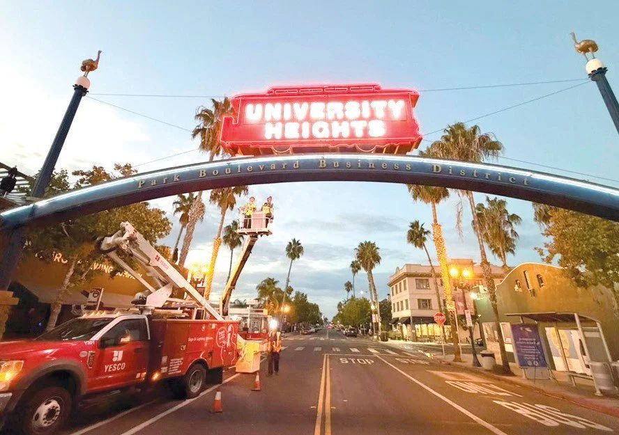  The glowing new neon on the University Heights sign. Photo by Marc Johnson. 