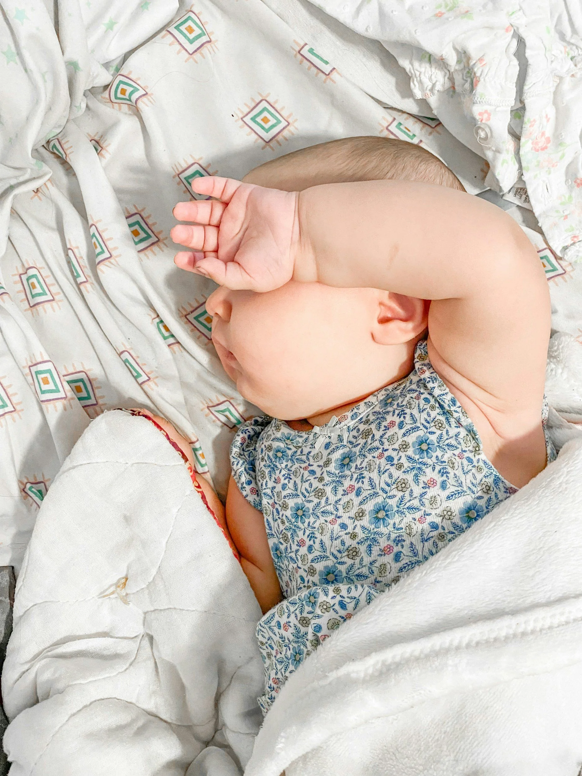 Sleeping baby receiving support from a Houston pediatric sleep consultant