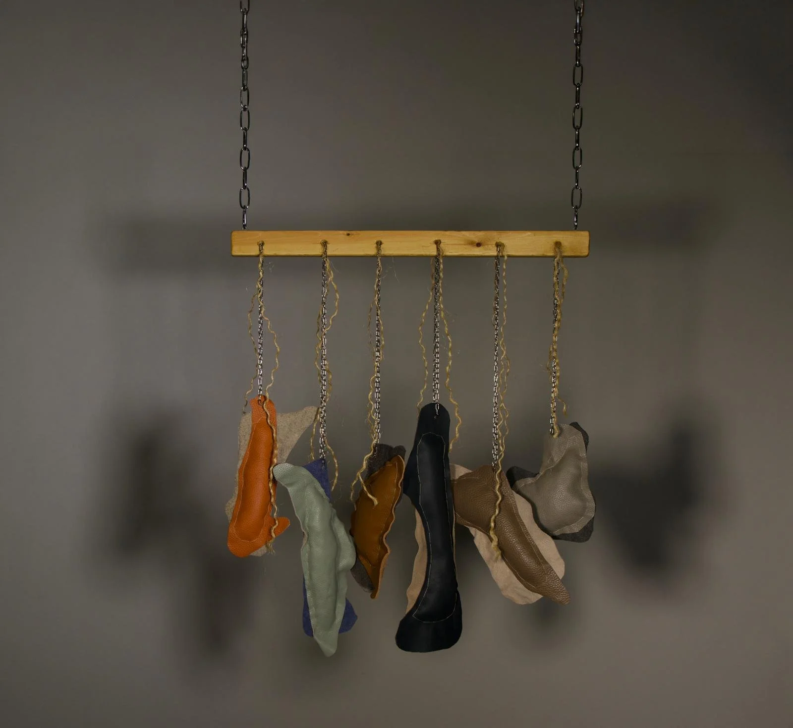 Glitch I, 2026, 
Recycled leather, wool, metal chain, wooden panel, and rope
H:165 x W:60 x D:5 cm