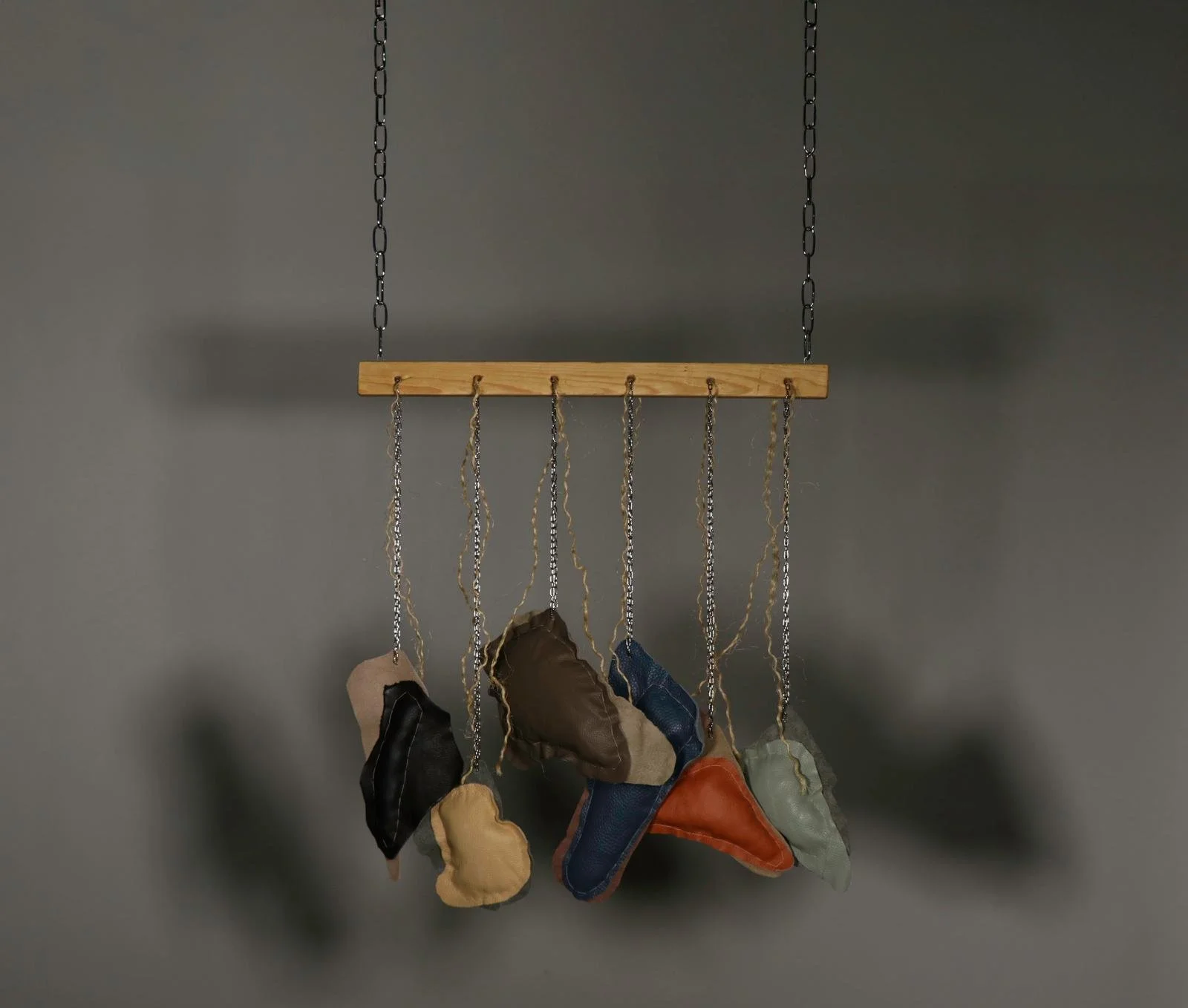 Glitch II, 2026, 
Recycled leather, wool, metal chain, wooden panel, and rope
H:165 x W:60 x D:5 cm