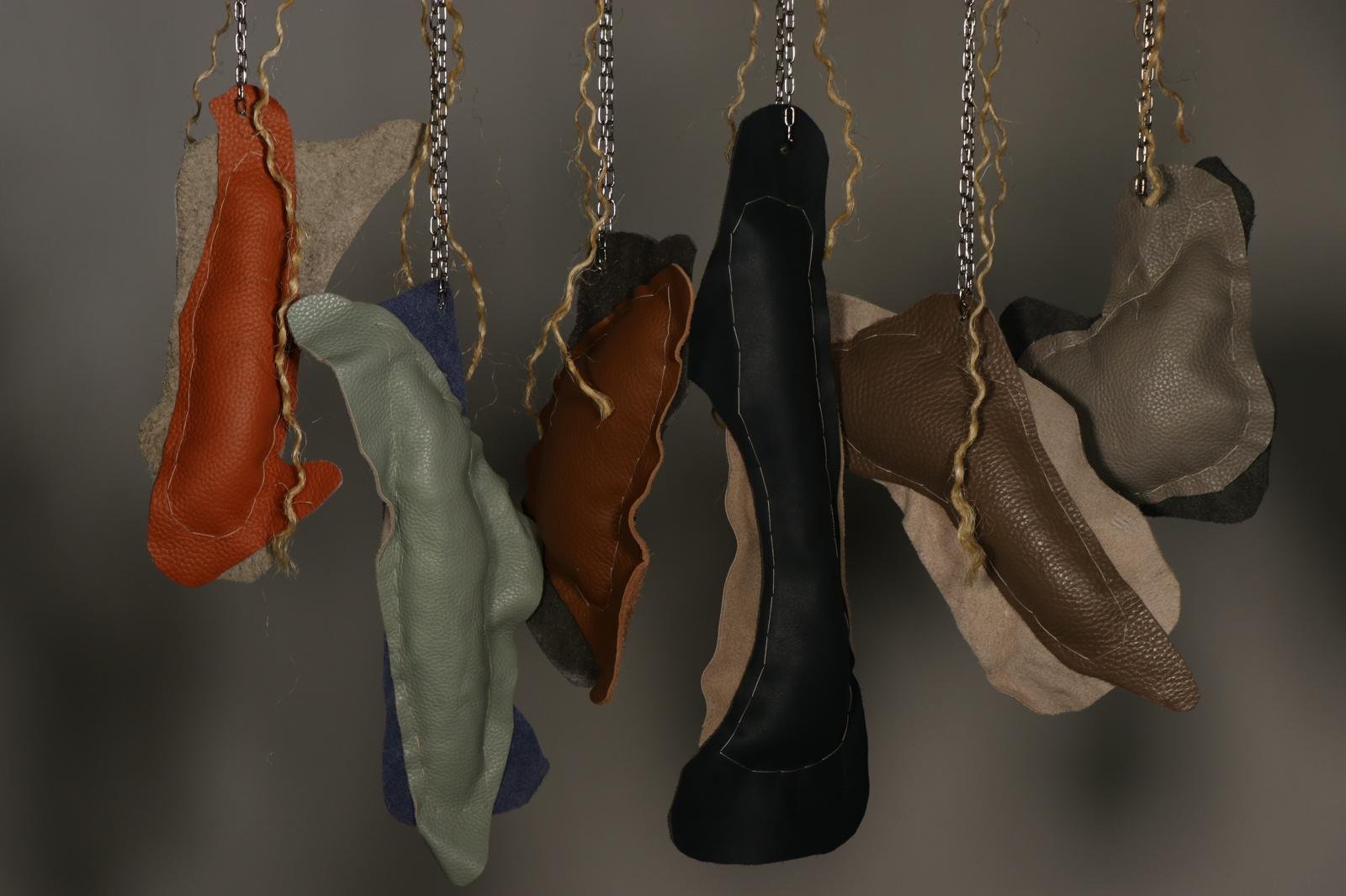 Glitch I, 2026, 
Recycled leather, wool, metal chain, wooden panel, and rope
H:165 x W:60 x D:5 cm