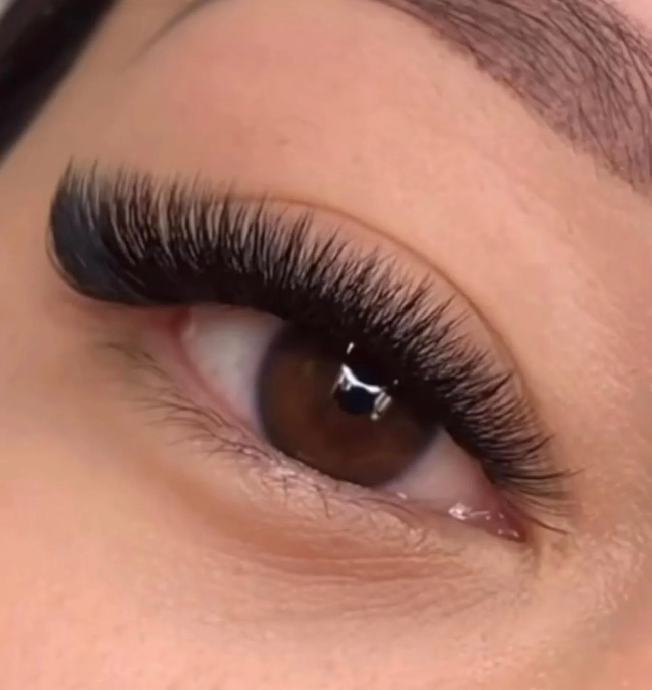 Full volume eyelash extensions customized by HuongDao Brow & Lash in Avon, Indiana.