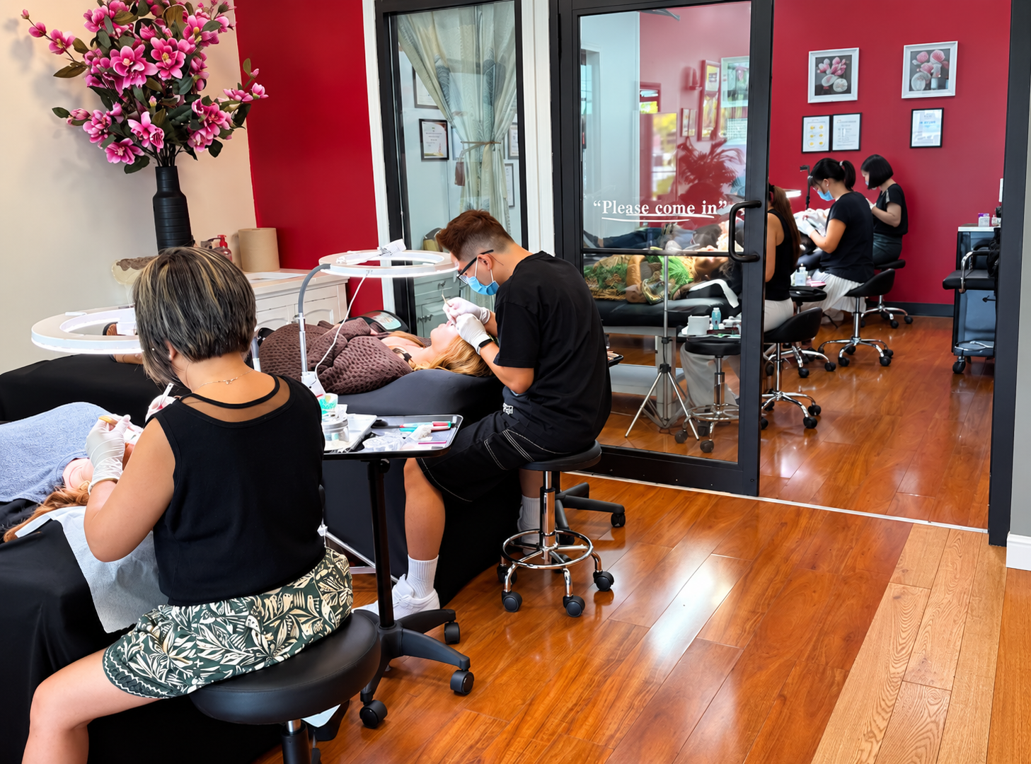 Inside HuongDao Brow & Lash in Avon, Indiana, with clients receiving professional beauty services.