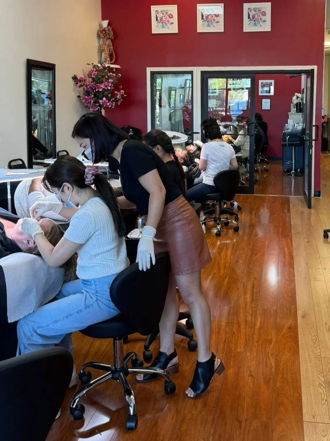 Inside HuongDao Brow & Lash beauty salon in Avon, Indiana, with clients receiving professional beauty services.