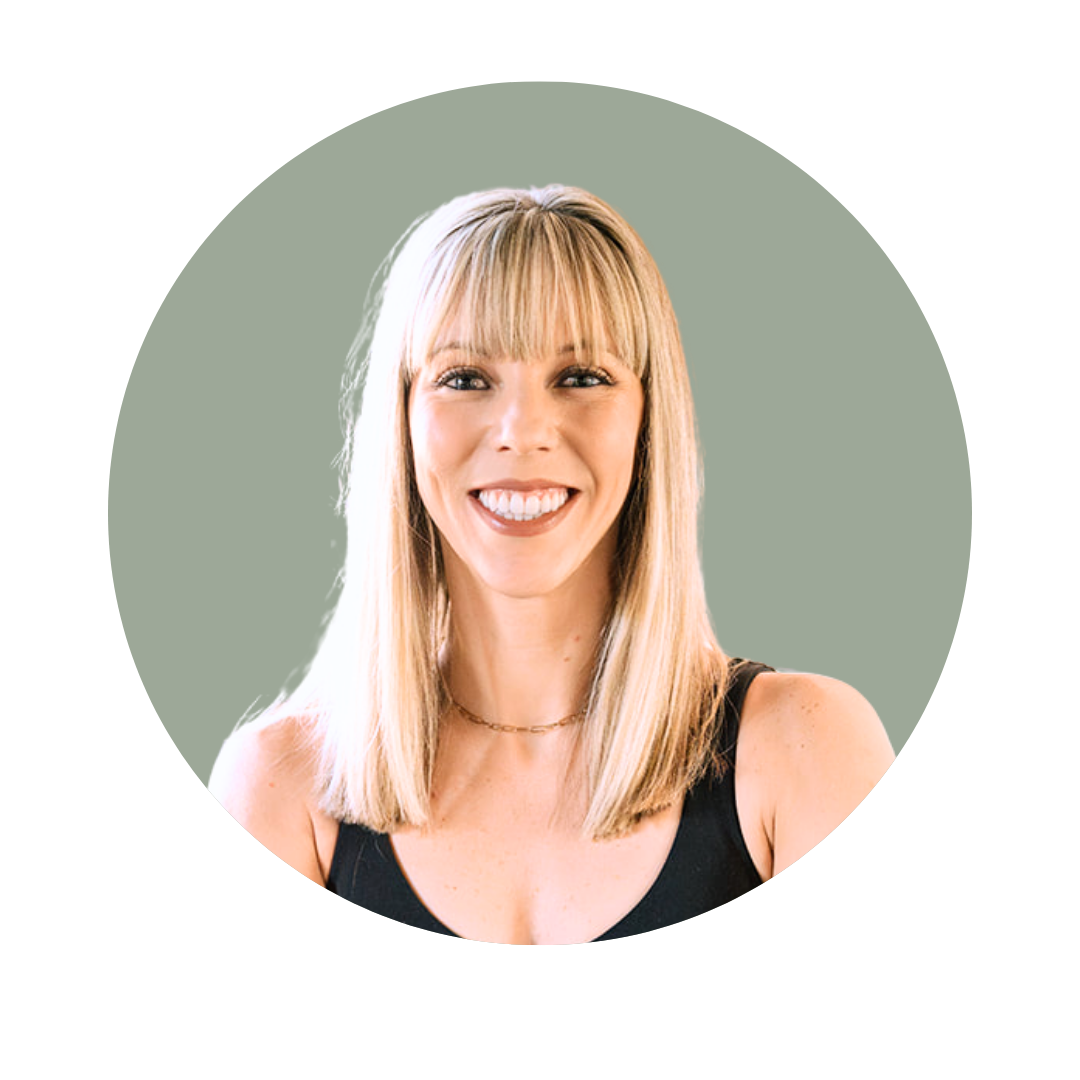 Woman with long blonde hair and bangs smiling, wearing a white top, in front of a dark green background.