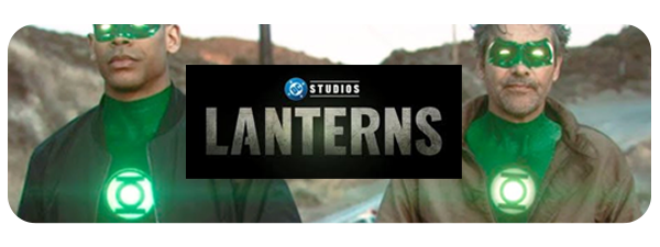 Two men dressed as members of the Green Lantern Corps, wearing green costumes and glowing green rings, standing outdoors with a