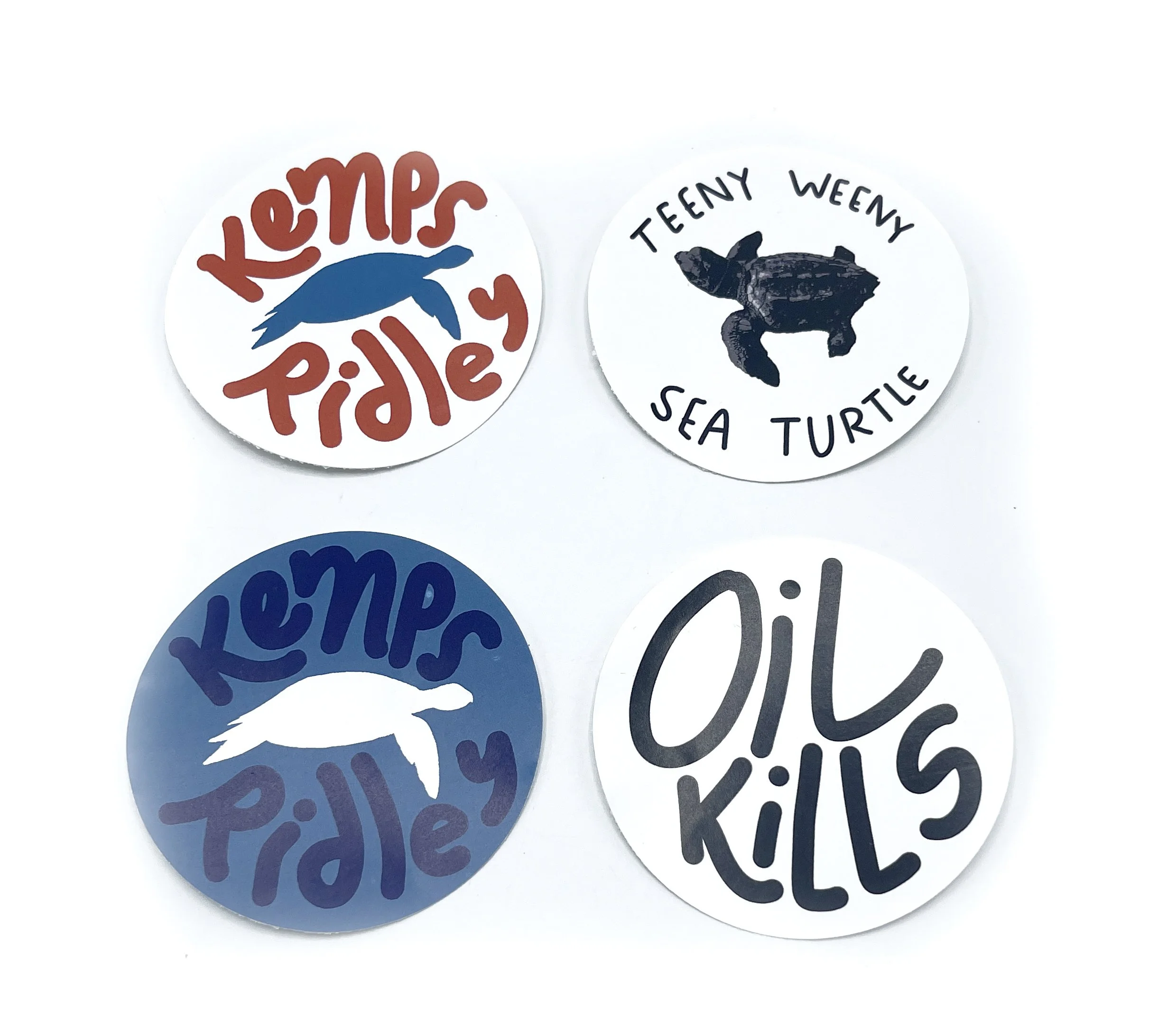 Close-up of three round stickers with text and images related to sea turtles; one sticker has the words 'Keep Ripple' with a blue sea turtle silhouette, another says 'Tiny Wenny Sea Turtle' with a black turtle illustration, and the third partially visible has words in a mix of light blue, grey, and dark grey.