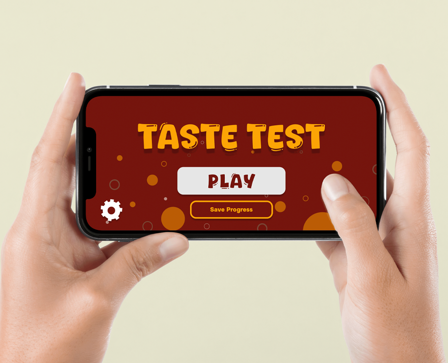 Person holding a smartphone with a game called 'Taste Test' on the screen, featuring a large 'Play' button and a 'Save Progress' option.