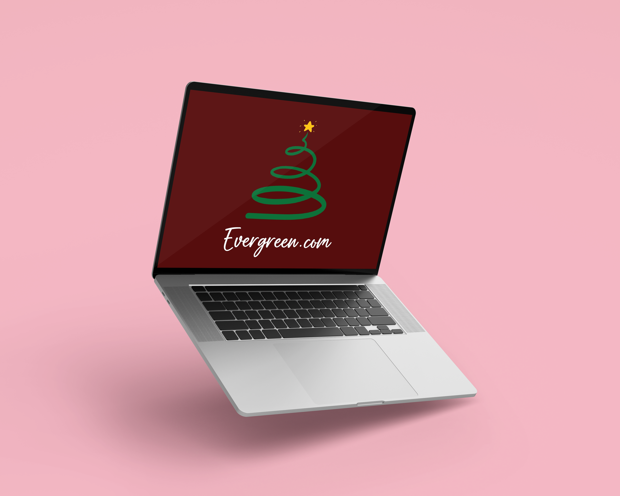 Two silver laptops with black keyboards on a purple background. The laptop on the right displays a red screen with a green Christmas tree illustration and the text 'Evergreen.com'. The laptop on the left has a black screen with the text 'ADVENTURE.COM' in gold.
