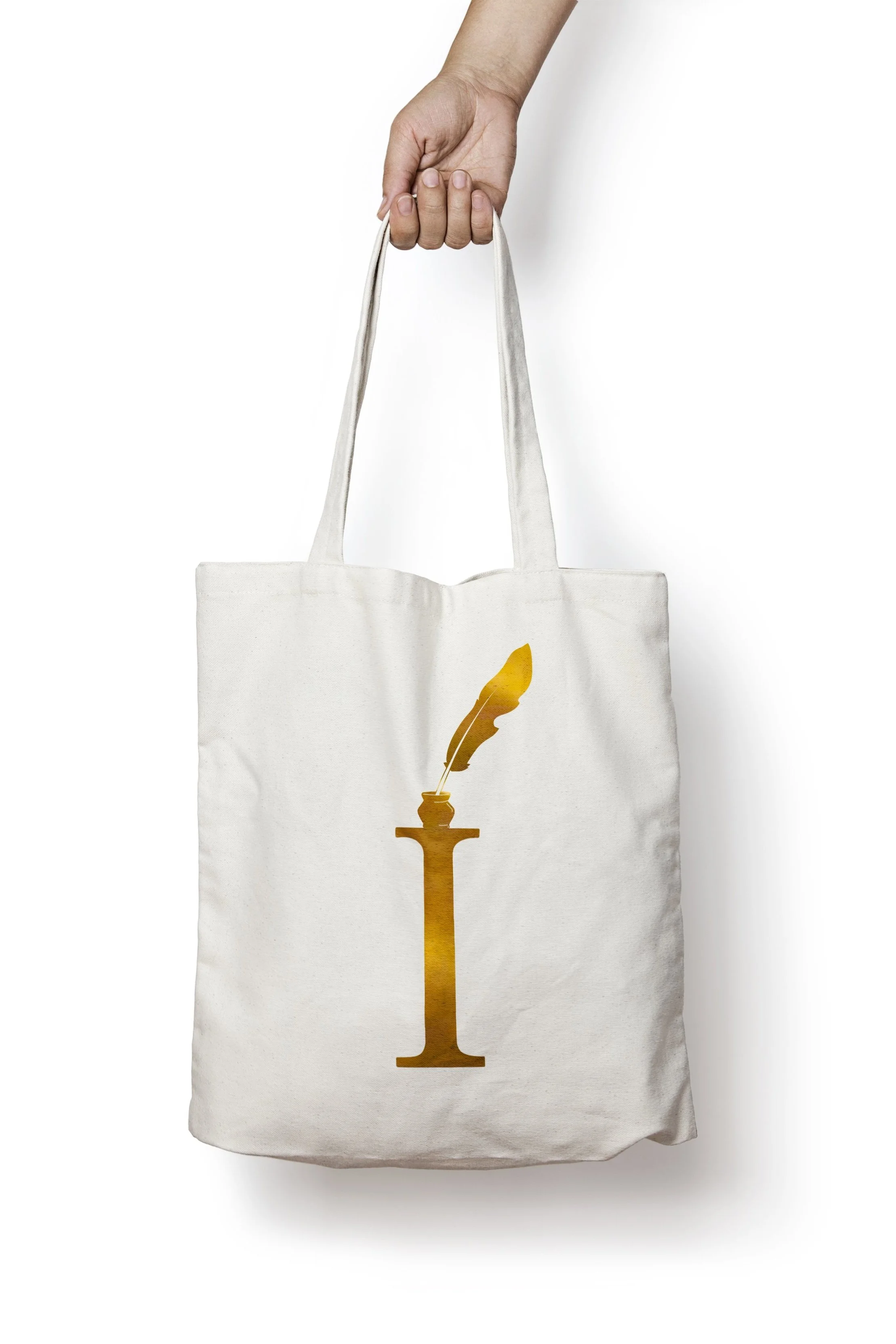 A white tote bag with a gold feather quill graphic printed vertically on the front.