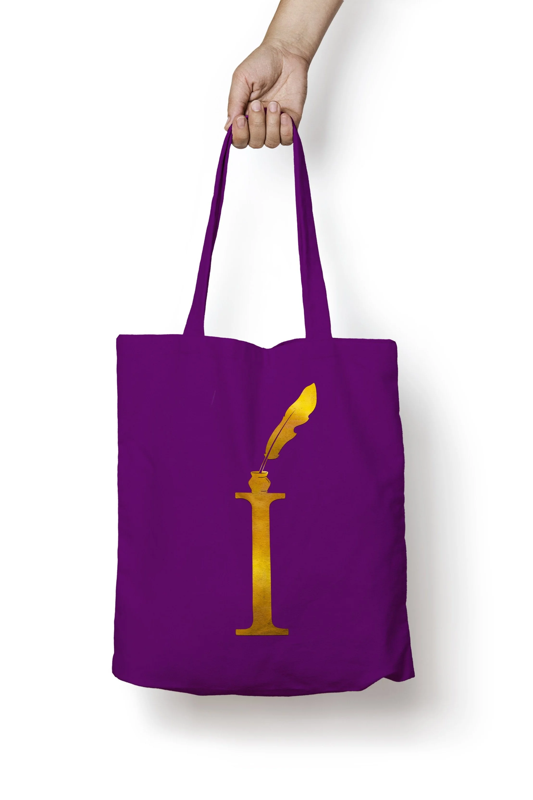 Purple tote bag with a gold quill and ink pot logo on the front, held by a hand against a white background.