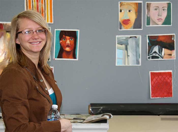 smiling-woman-painting-studio.jpg
