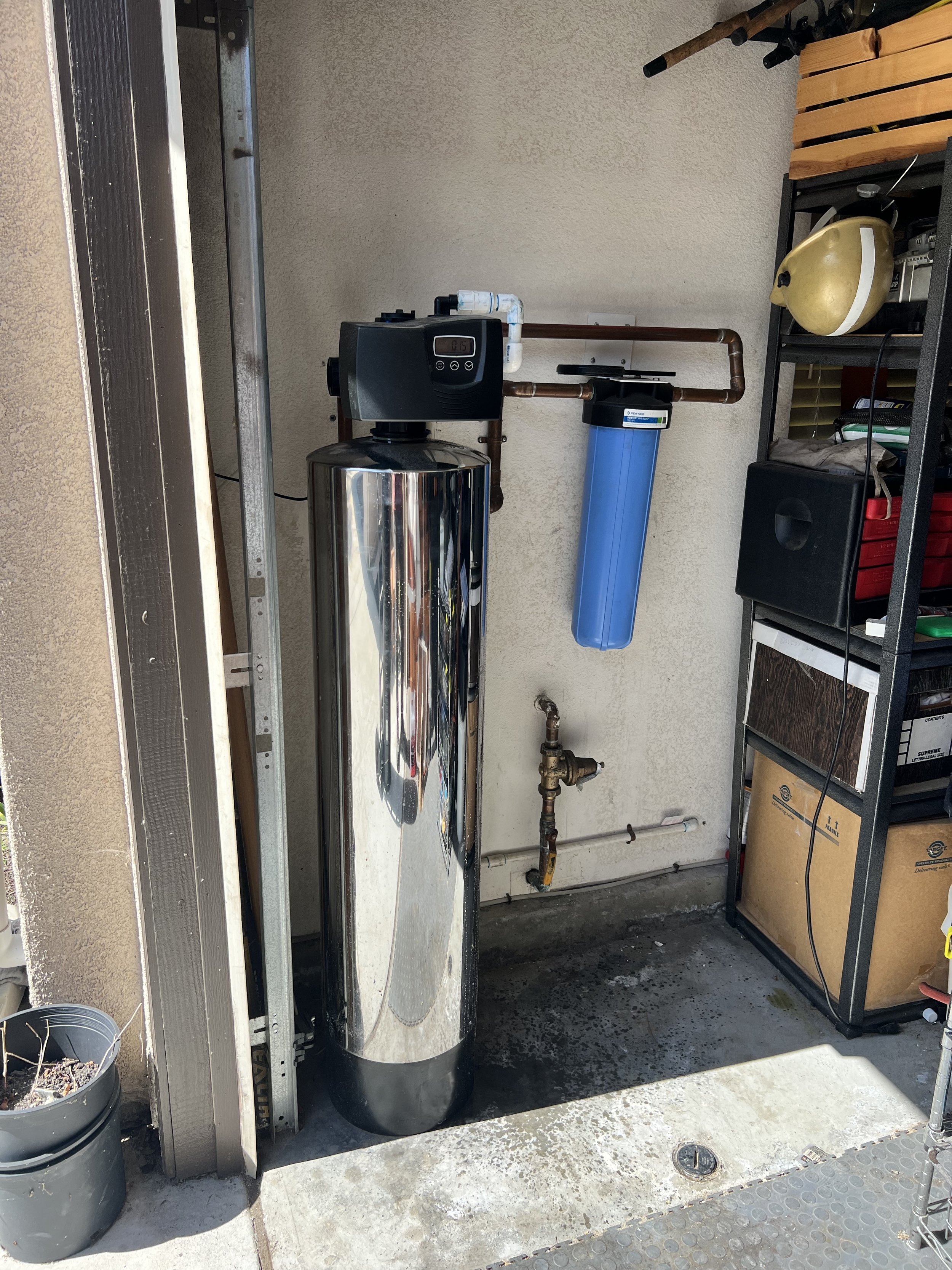 Whole house water filtration system with added fluoride filter installed in Del Mar, CA garage.