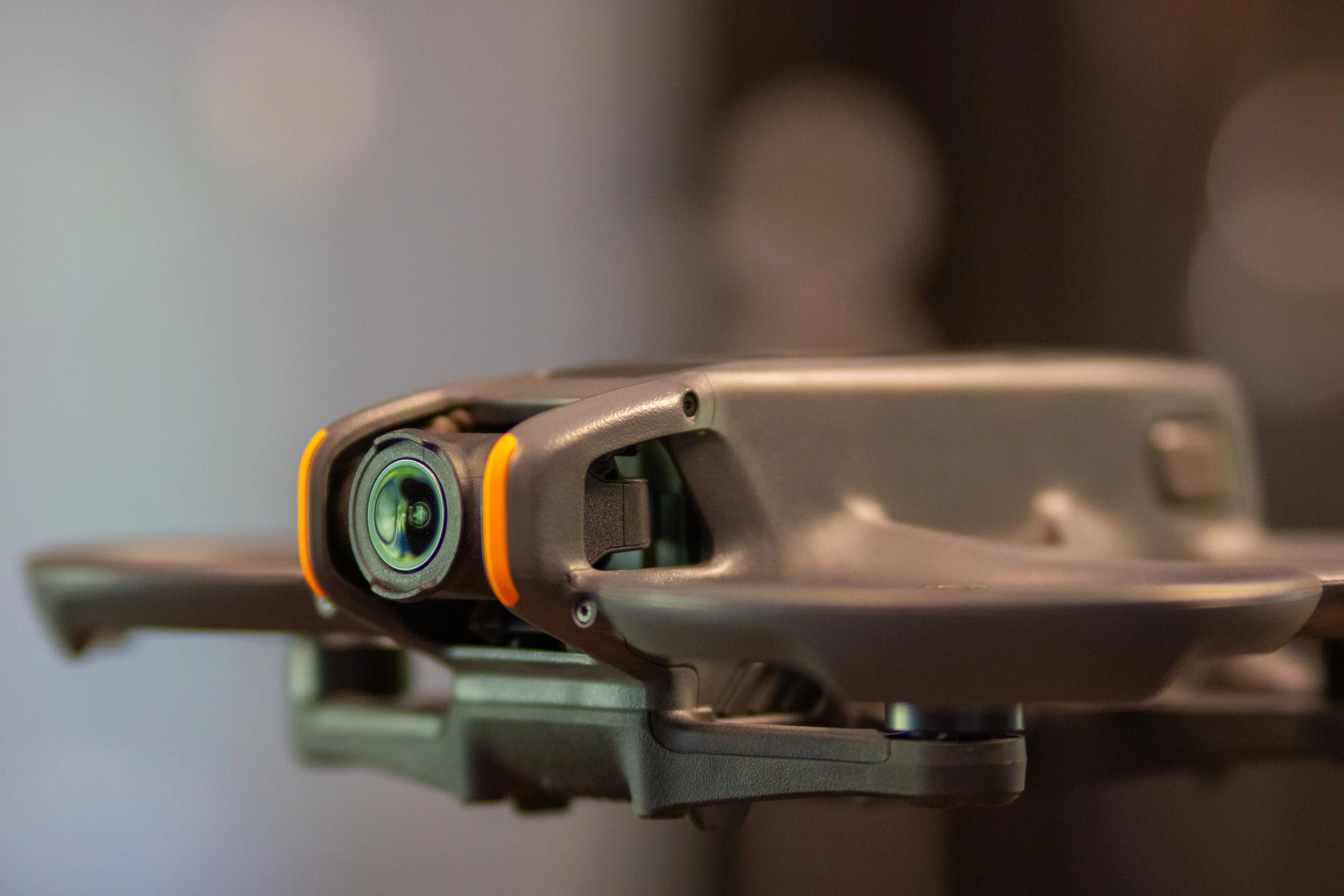 Close-up of a professional video camera mounted on a stabilizer, with blurred background.
