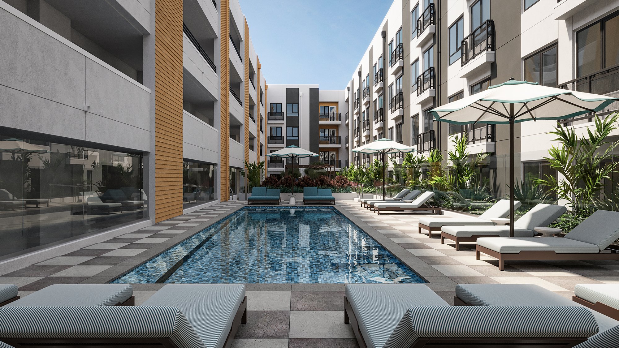 Resort-style pool area with lounge chairs and umbrellas at Warner Center apartments, designed for modern relaxation..jpg