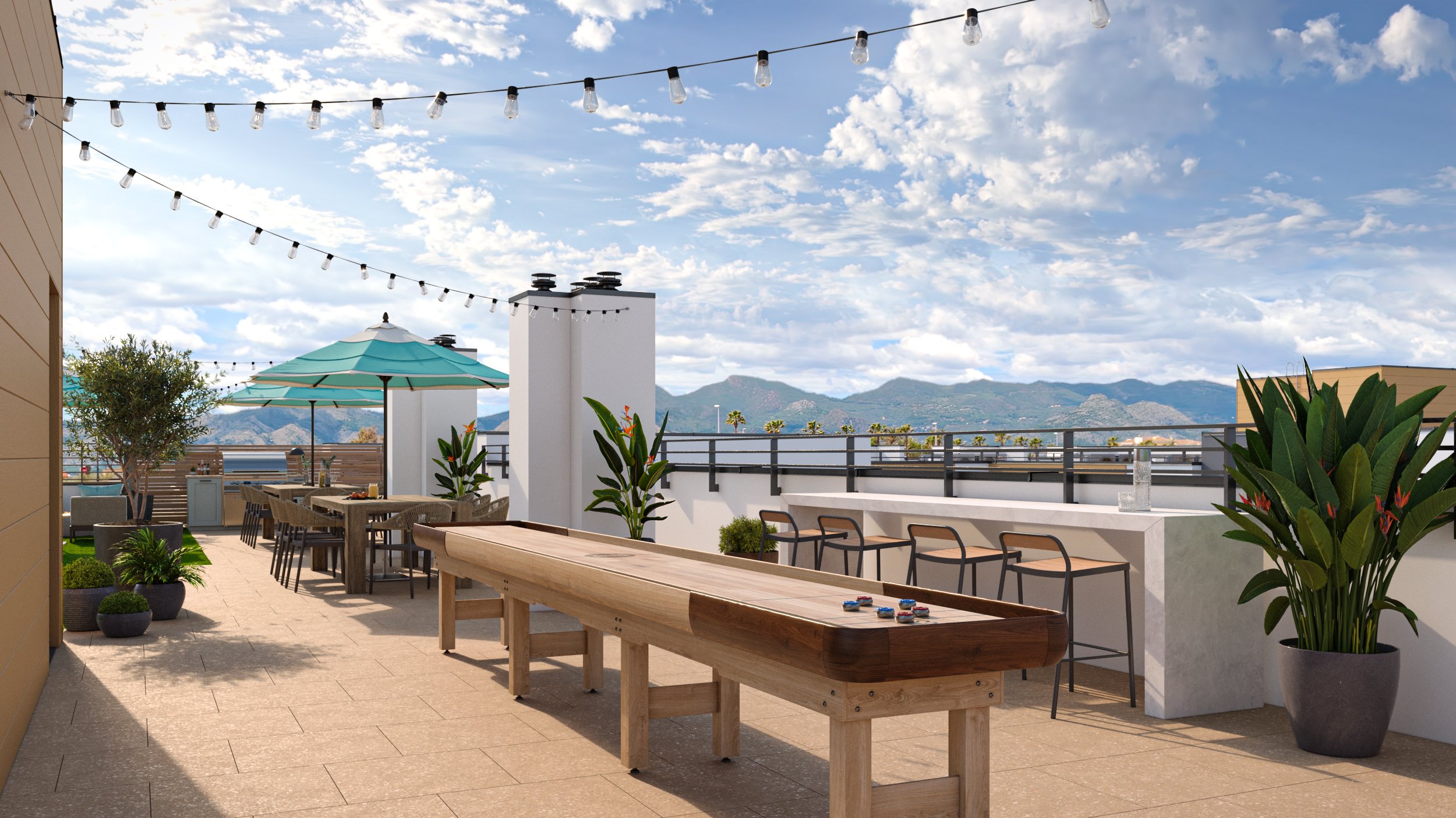 Rooftop bar and lounge area at Warner Center apartments with mountain views and resort-style seating..jpg
