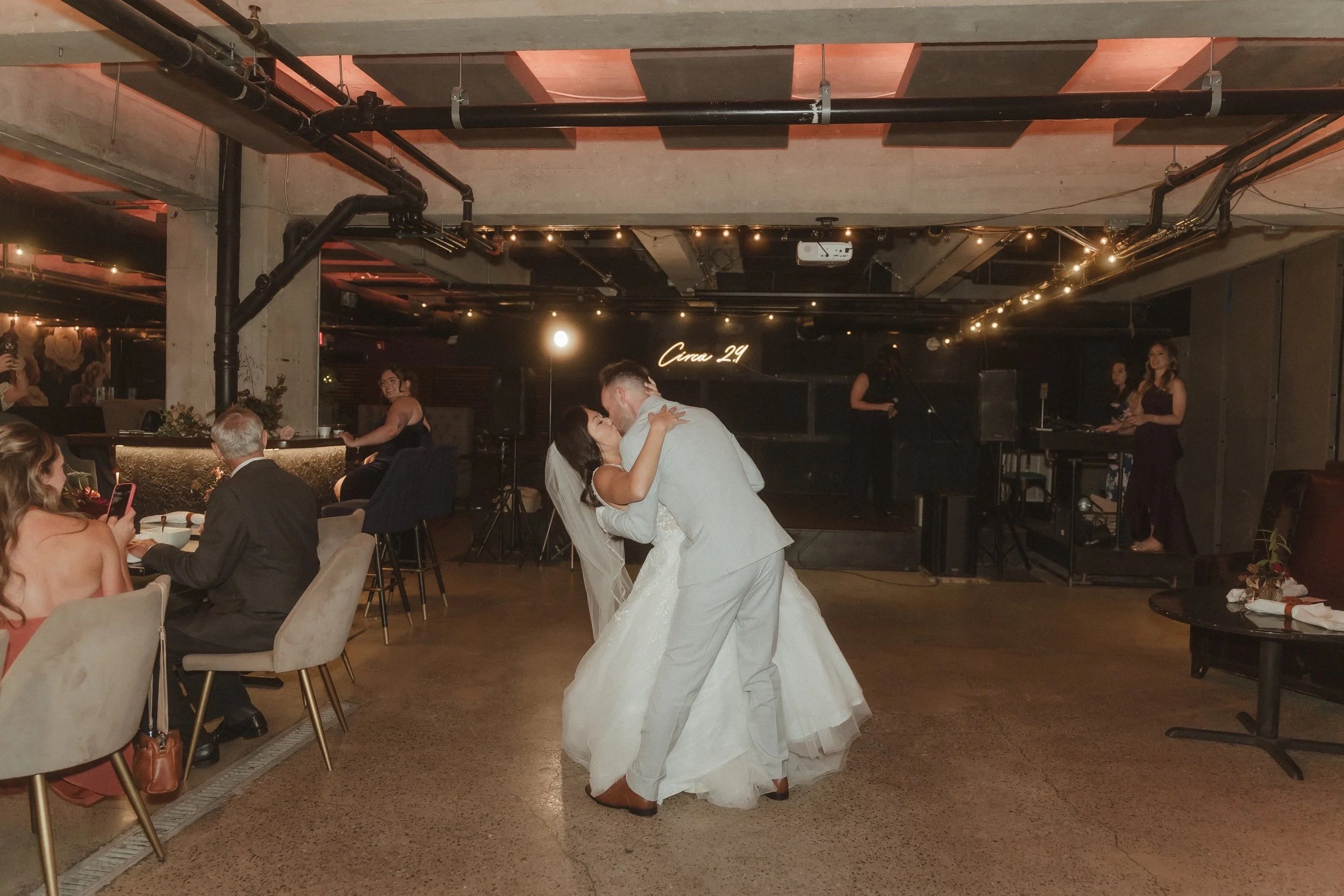 Bride and Groom kissing at reception