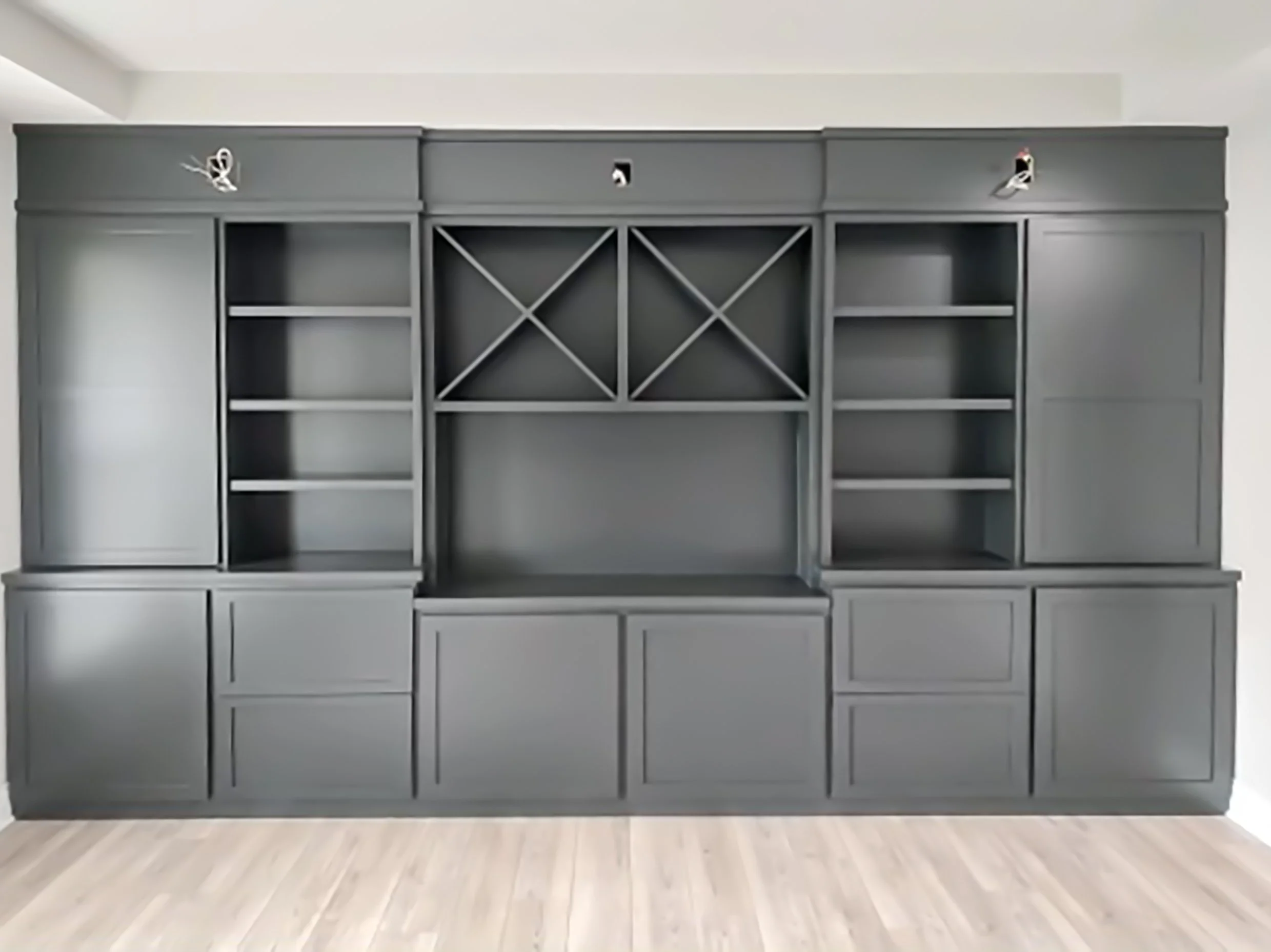 Custom Built-In with a combination of open shelving, cabinets with shaker doors and x-shaped dividers in open cubbies