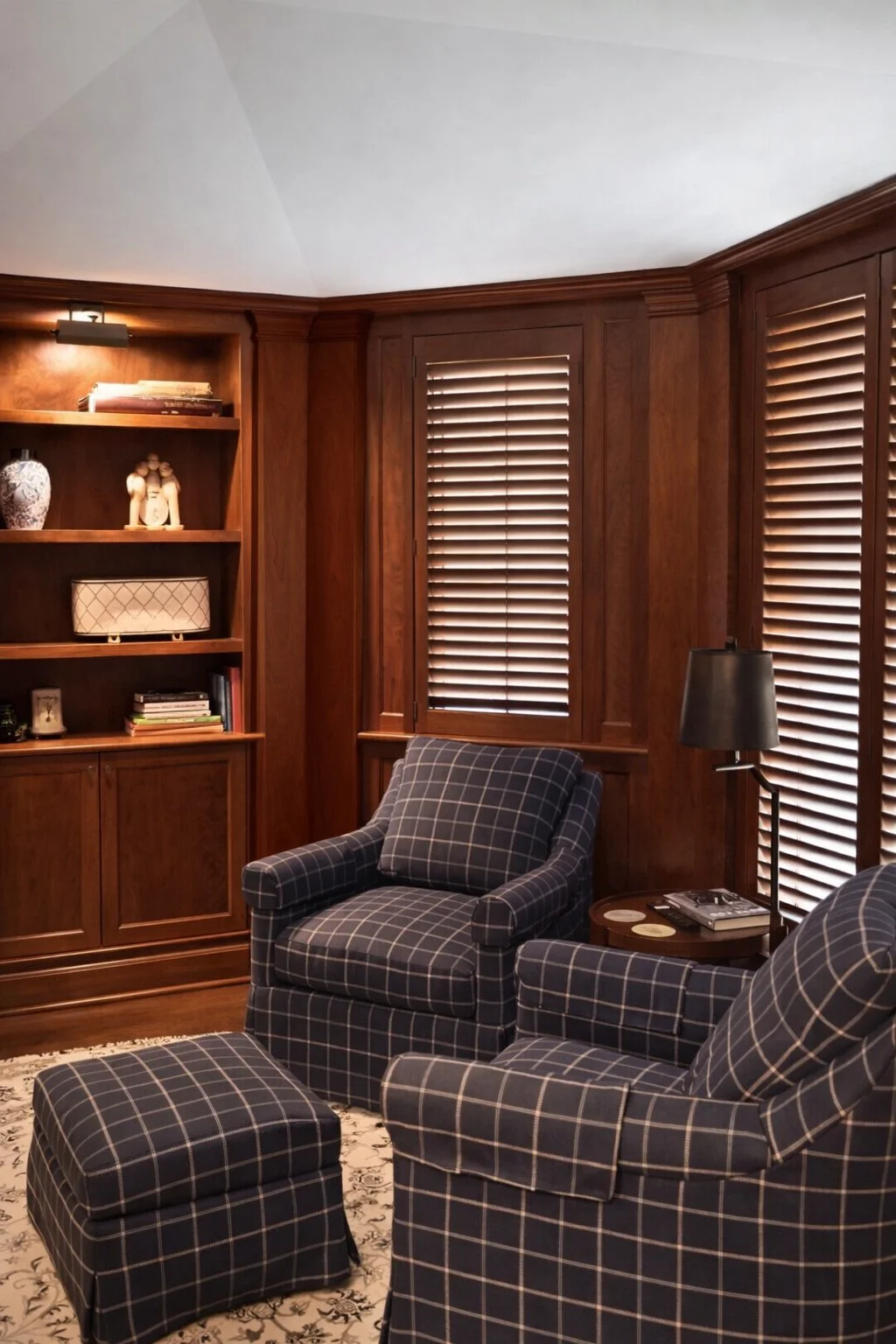 Custom wrap-around full room built-in with solid cherry trim work around windows and door casing. Cherry judges panel wainscoting.