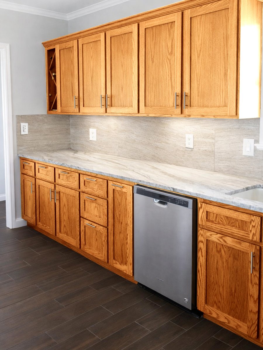 Red oak custom kitchen with shaker-style doors and drawer fronts. Soft-close dovetailed oak drawers. Stained red oak with clear lacquer sprayed finish.  Photo 2 Hurricane Harvey Rebuild