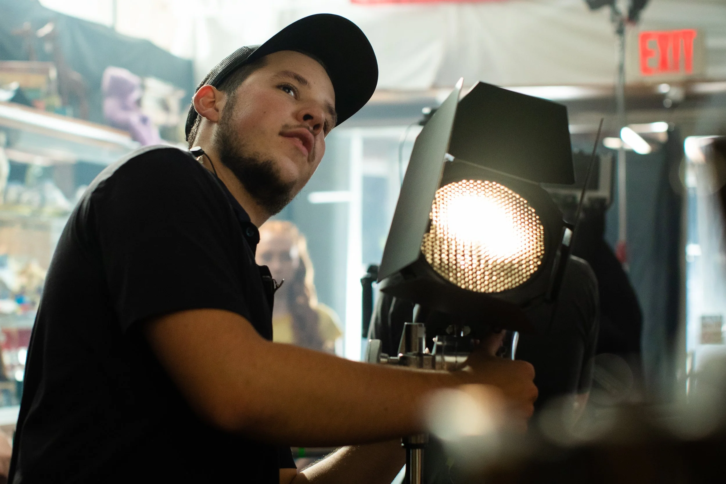 Gaffer lighting a commercial shoot