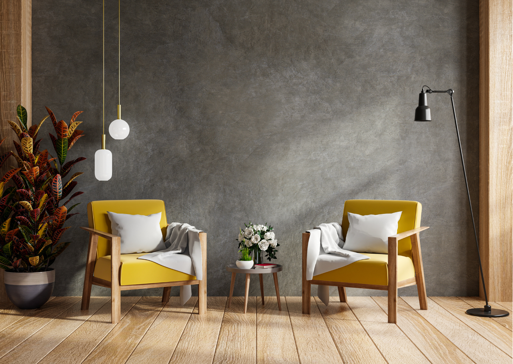Modern waiting area with two yellow armchairs, each with a white pillow and throw blanket, positioned on a wooden floor against a gray textured wall. A small round table with a white vase of white roses and a red book is between the chairs. To the le