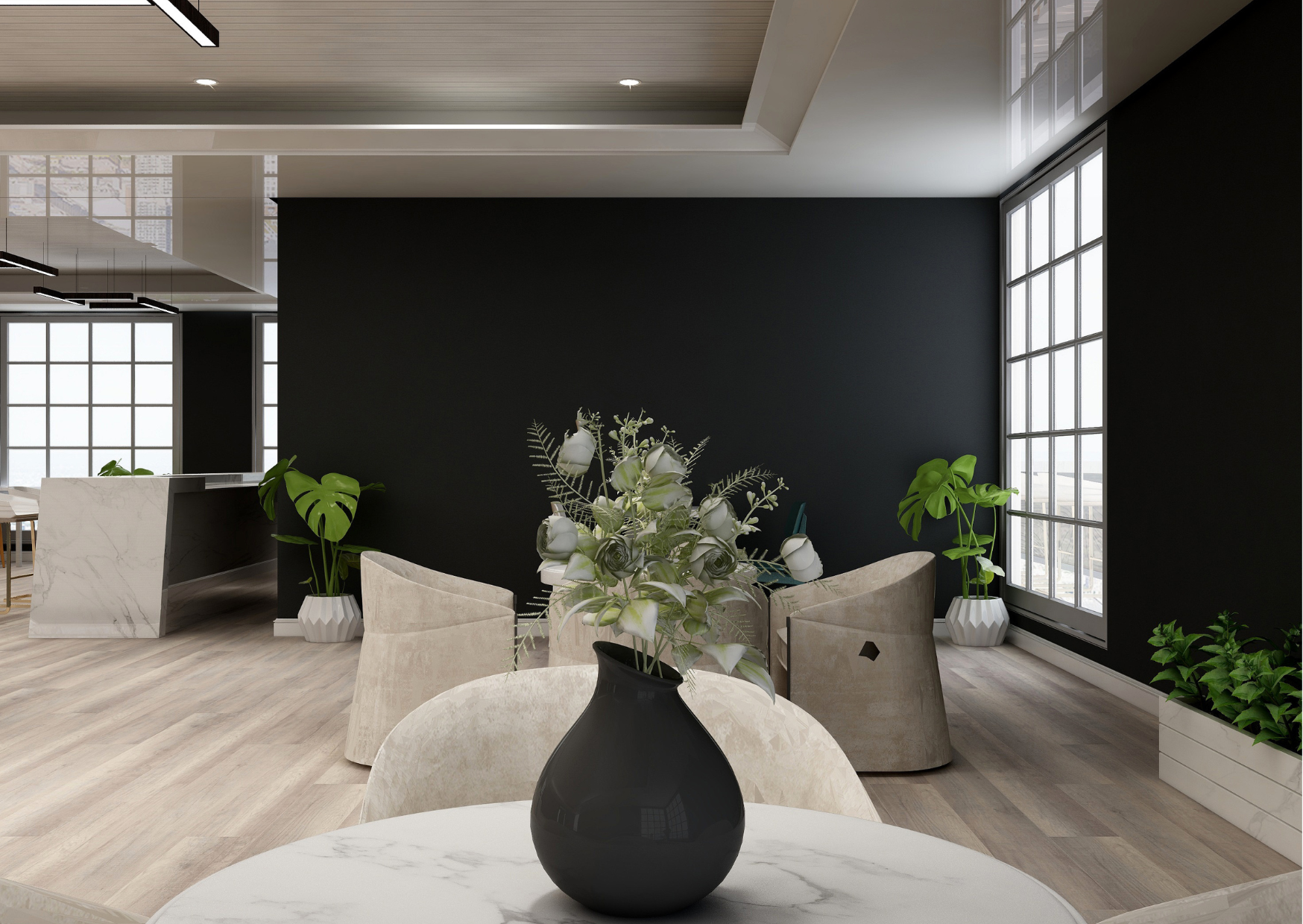 Modern indoor space with a round white marble table and black vase with white flowers in the foreground, beige chairs, green plants in white pots, large windows, and dark accent wall.