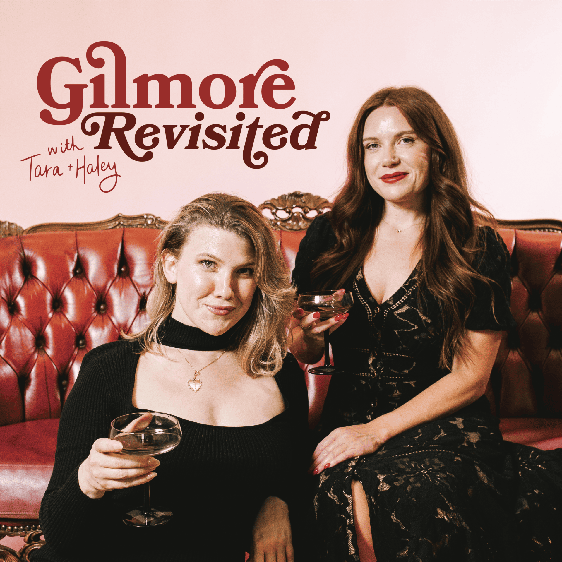 Two women sitting on a vintage red leather couch holding glasses of wine, with the words 'Gilmore Revisited with Tara + Haley' on a white background behind them.