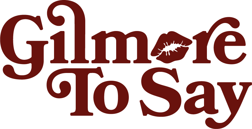 Text reading 'Gimme to Say' with a lipstick kiss mark in place of the apostrophe