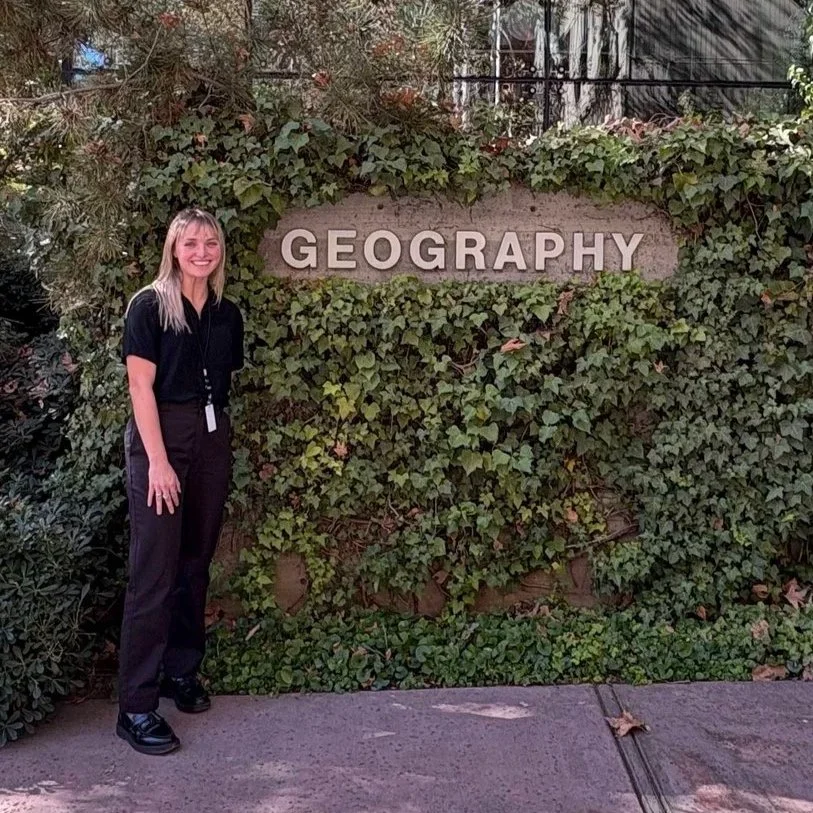 Lisa Carter in front of Esri's famous geography sign