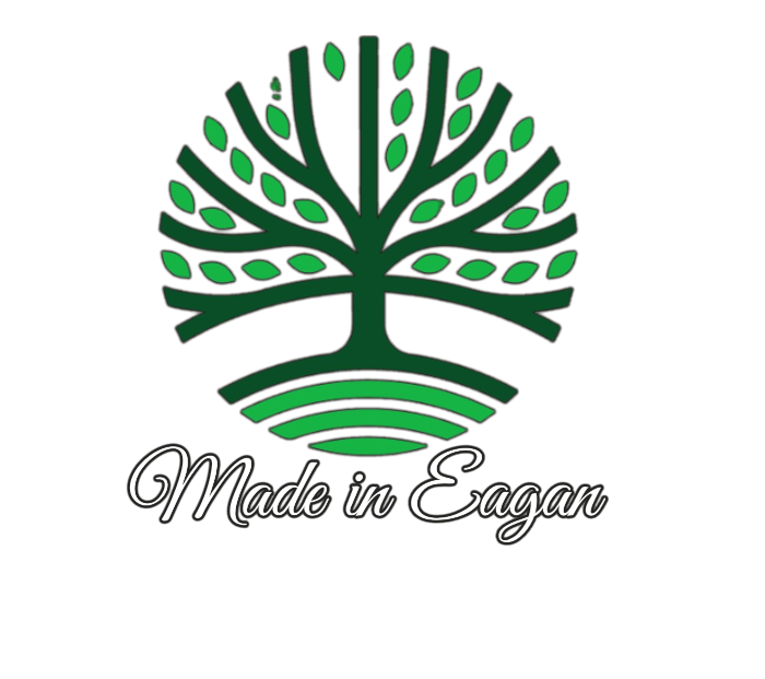A logo featuring a stylized green and black tree above the words 'Made in Eagan' in cursive font.
