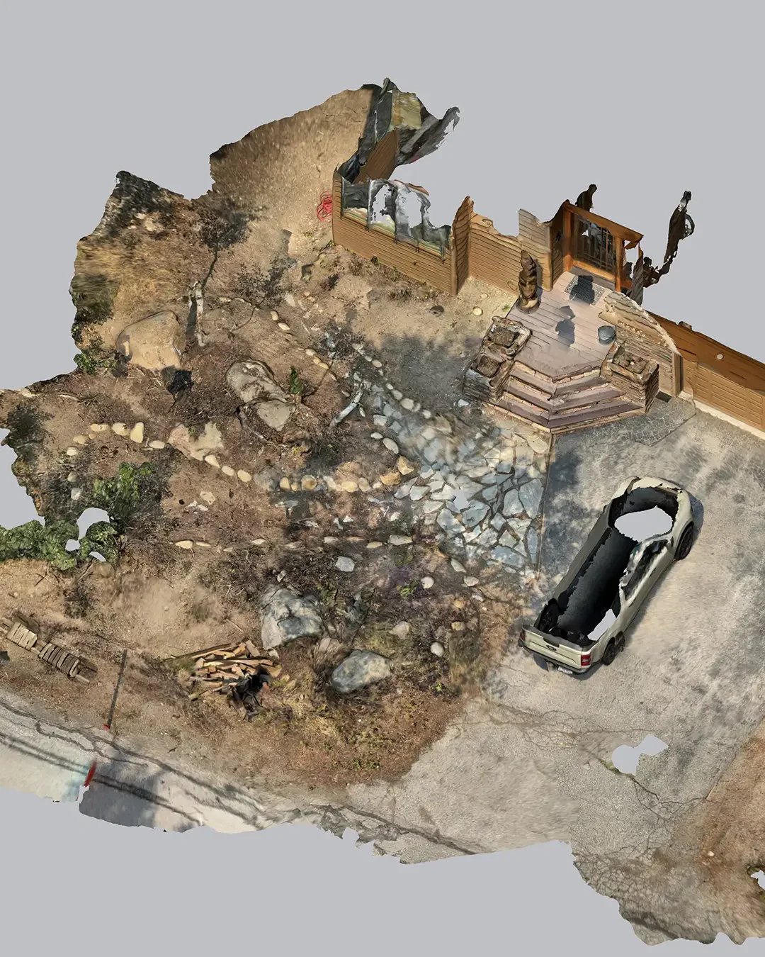 A 3D rendered top-down view of a backyard with a wooden deck, stone steps, a parking spot with a burnt-out car, a garden with rocks, trees, and dirt, and some construction materials.