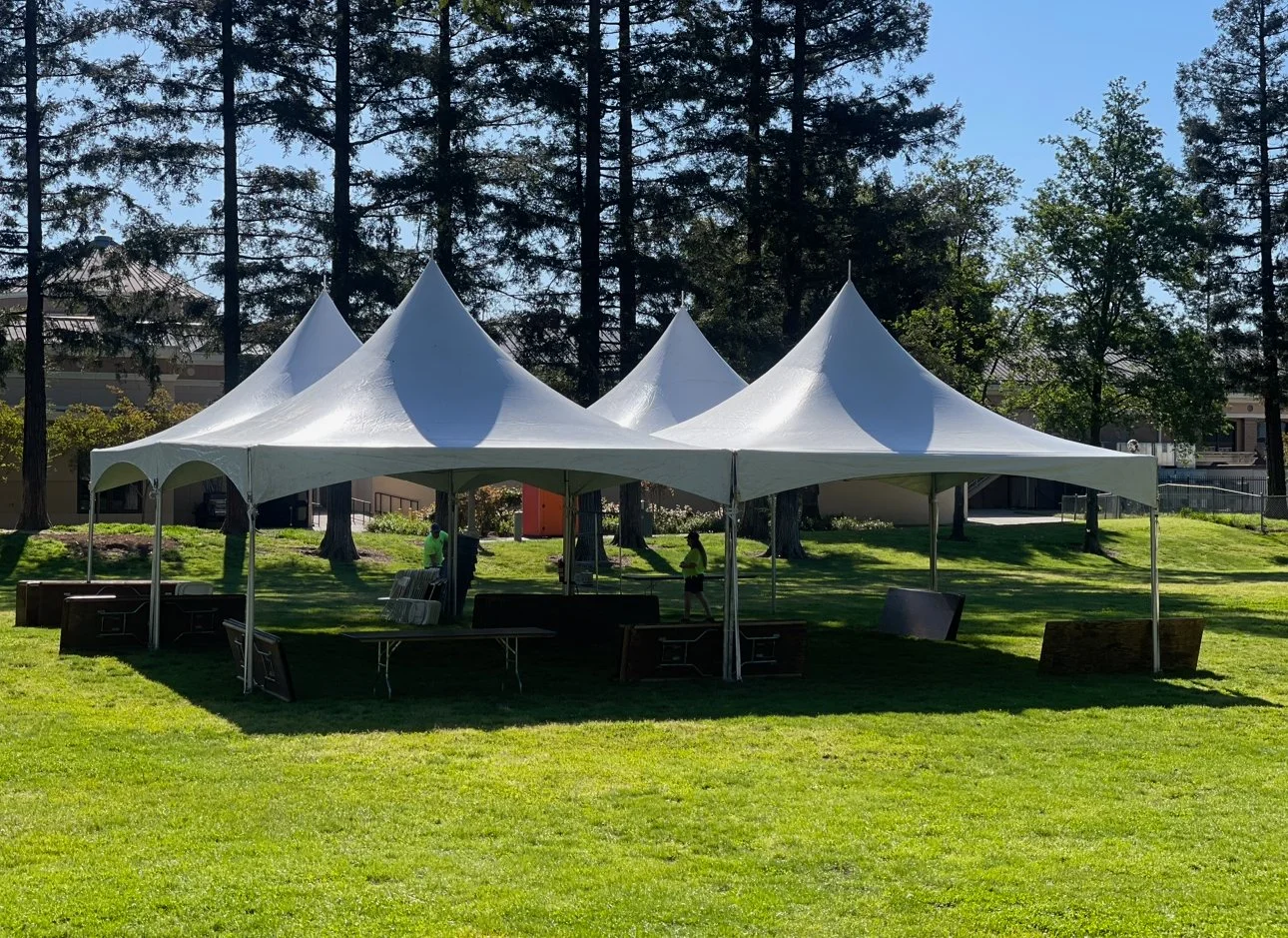 Several marquee tents set up at a park for a birthday party in Galt, CA.