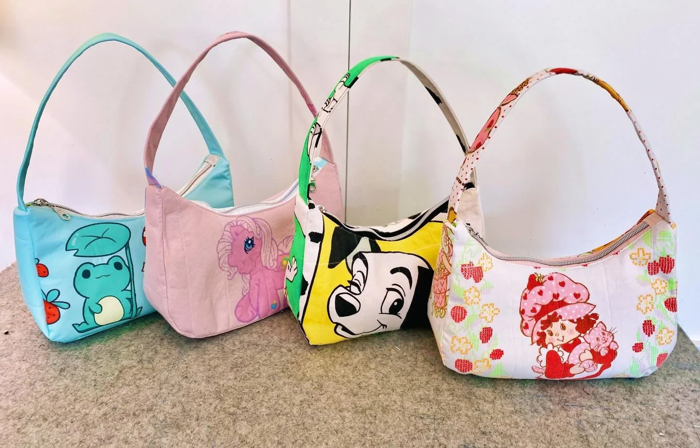 More Upcycled Shoulder Bags available now on my website! 

#strawberryshortcake🍓🍰 
#101dalmatas 
#frogs 
#mylittlepony